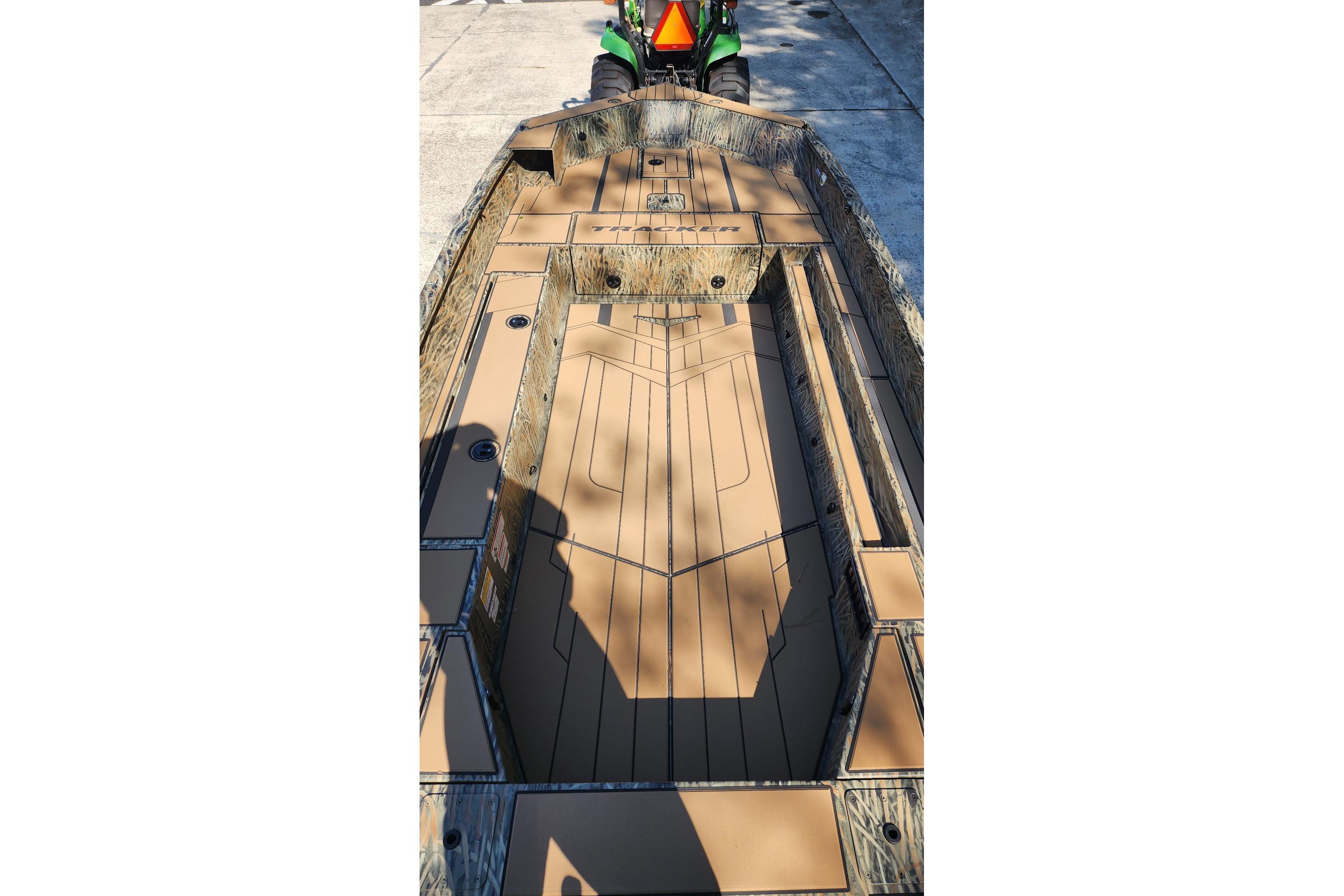 2026 Tracker Grizzly 1756 T Marsh boat interior with camouflage design and spacious layout.