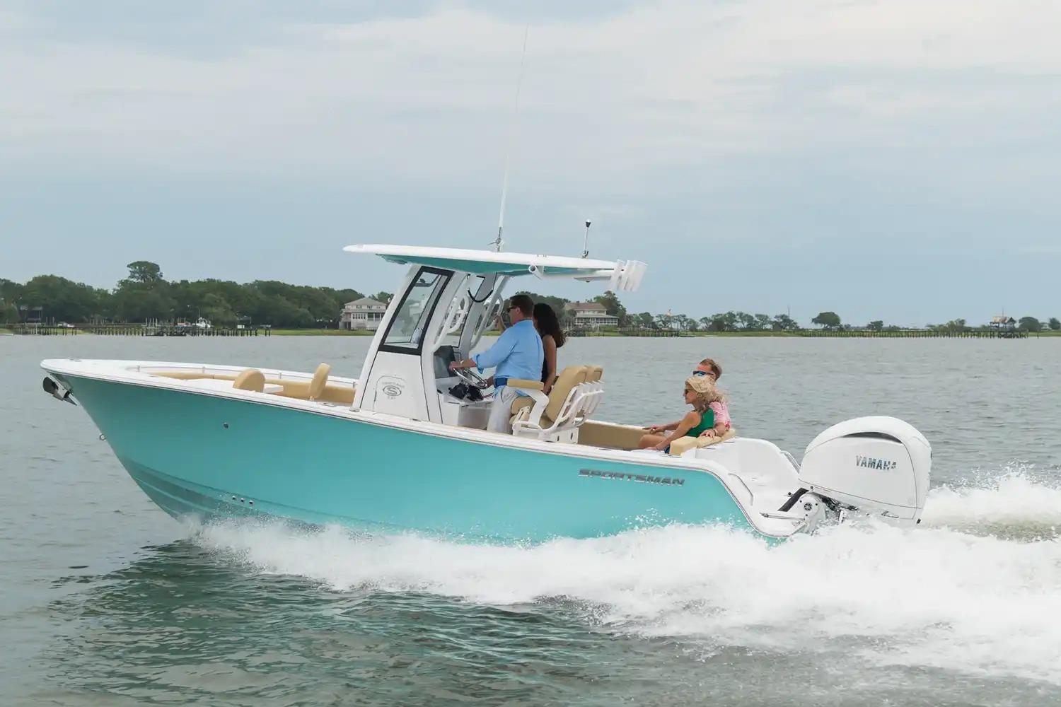 Manufacturer Provided Image: 2026 Sportsman Heritage 231 Center Console boat cruising on a calm lake.