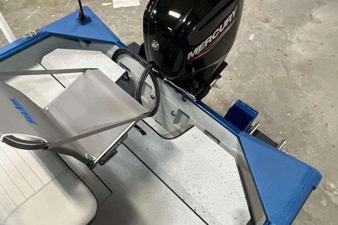 2025 SeaArk Shadow 187T boat with Mercury outboard motor, featuring blue and gray interior.