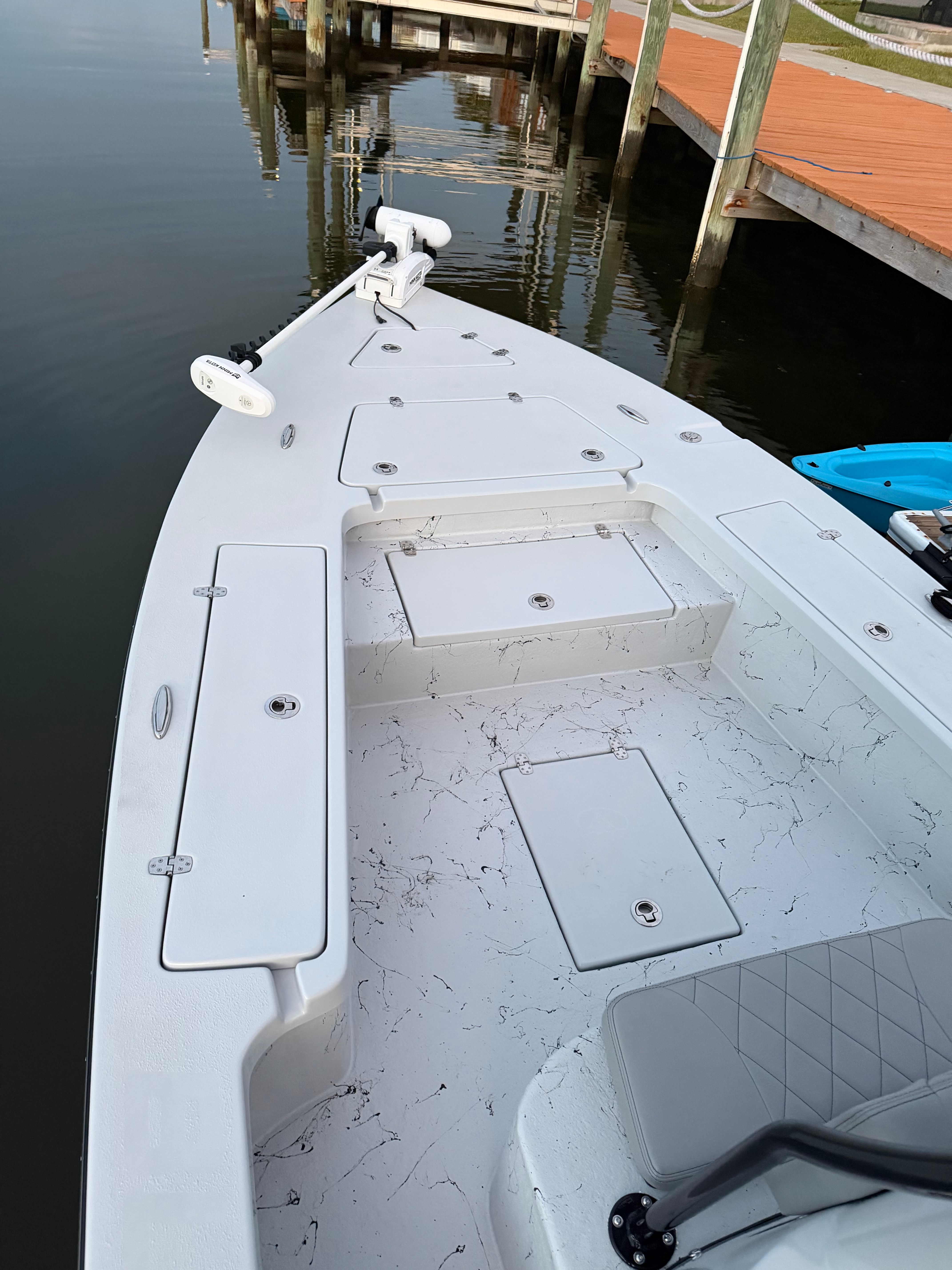 The image shows the deck of a 2022 Blazer Bay 2420 GTS boat with storage hatches.