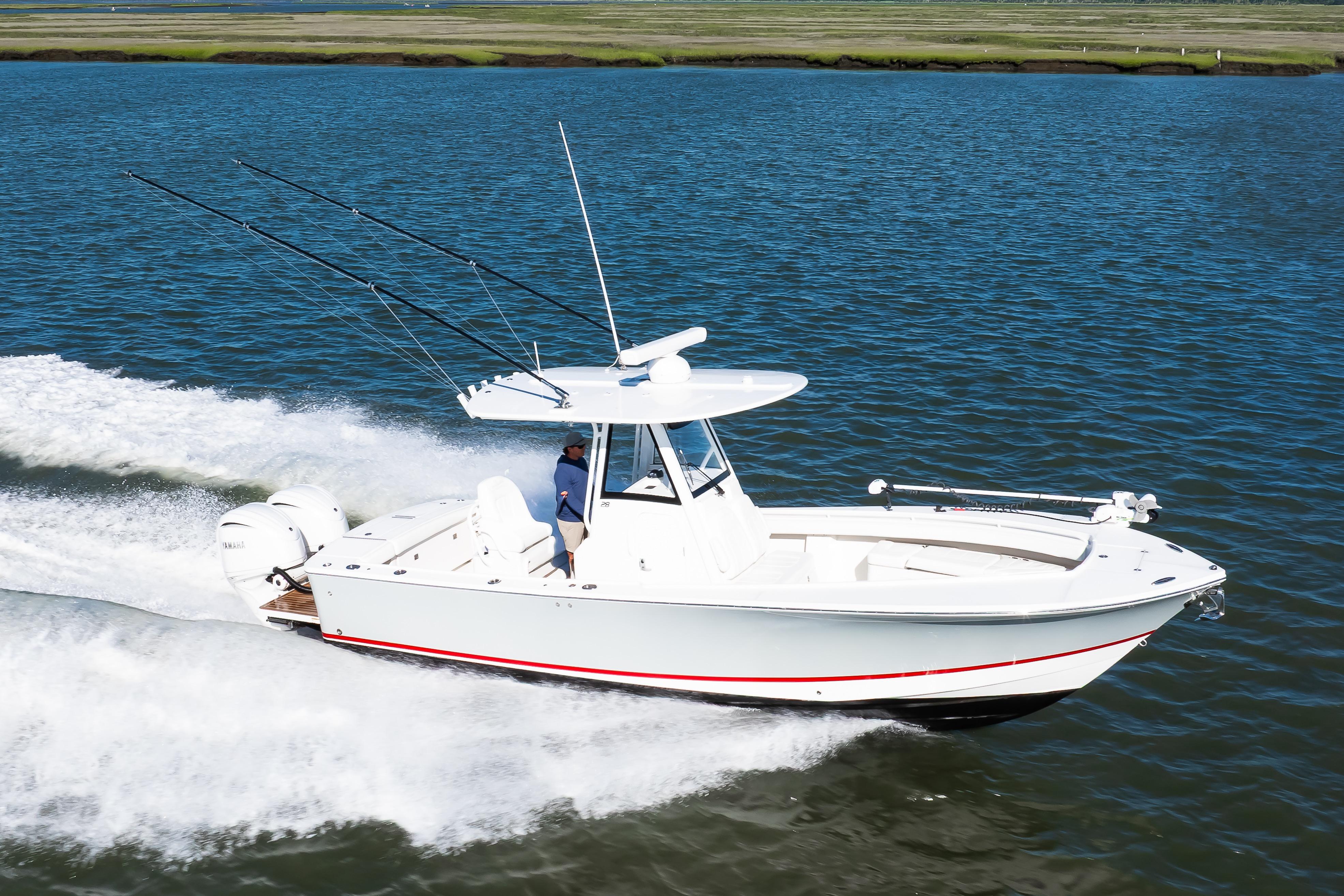 2022 Regulator 28 Forward Seating boat cruising on open water.