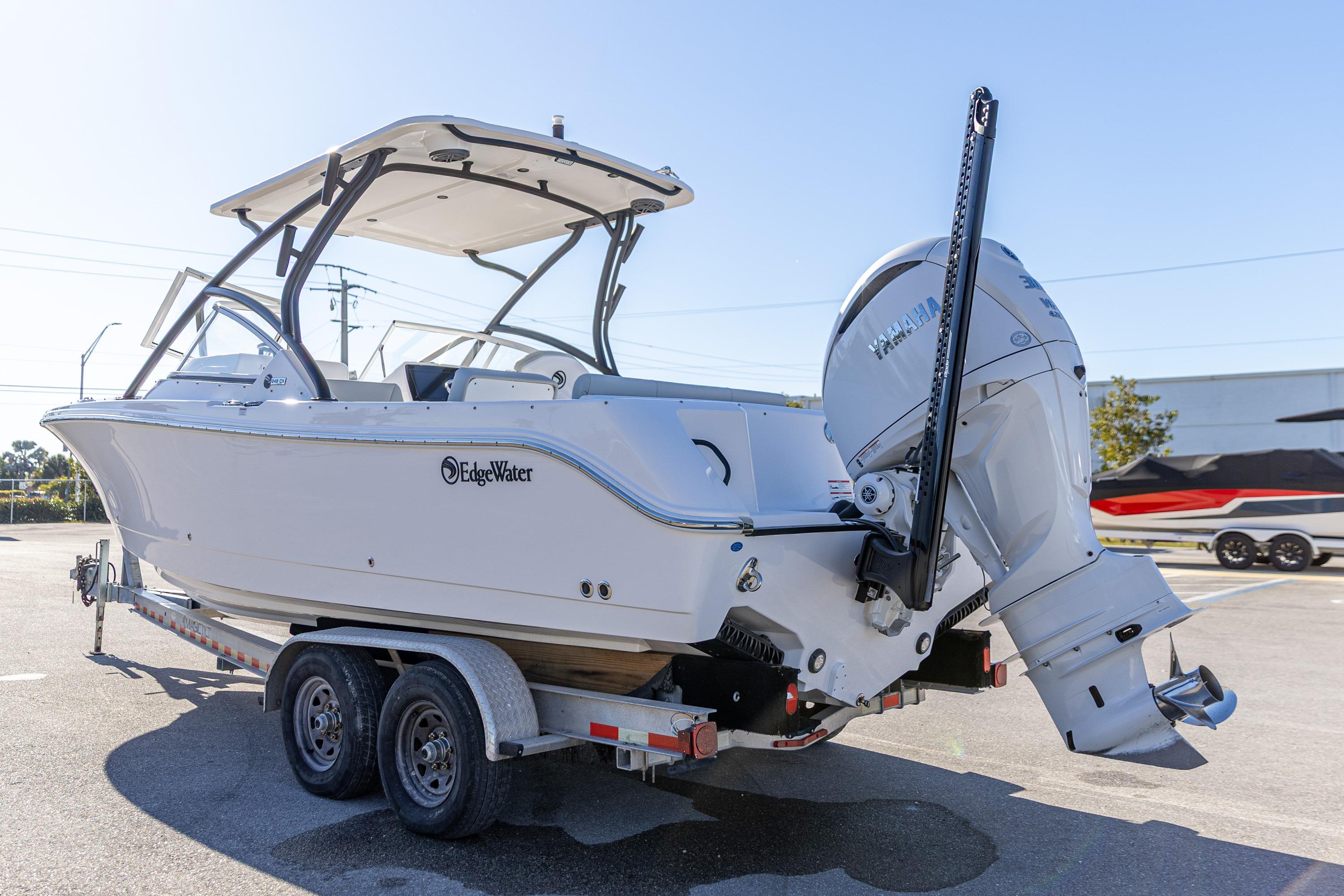 2025 Edgewater 248CX Crossover boat on trailer, featuring Yamaha outboard motor.