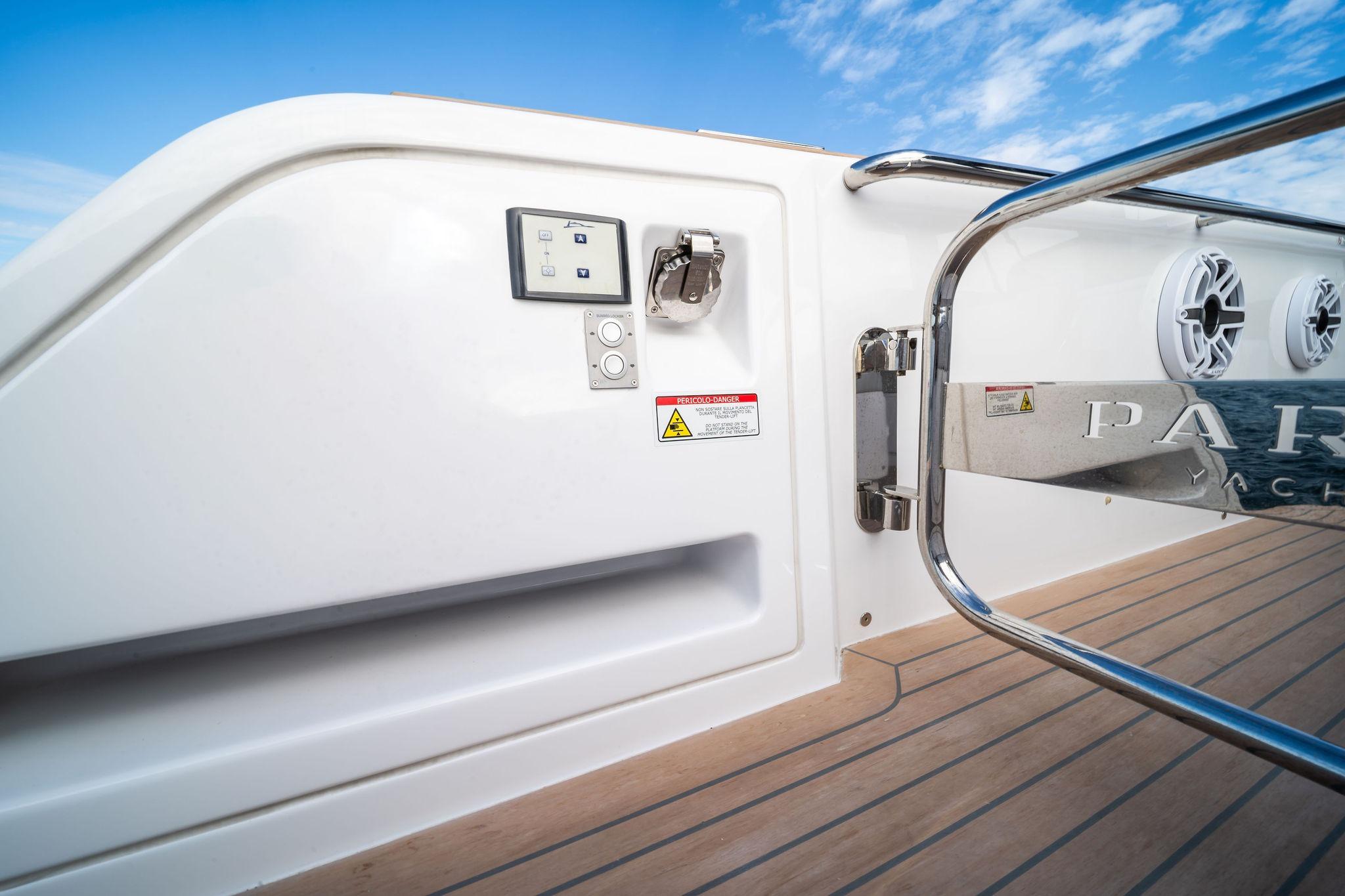 2024 Pardo Yachts 43 deck detail with control panel and speakers, under a clear blue sky.