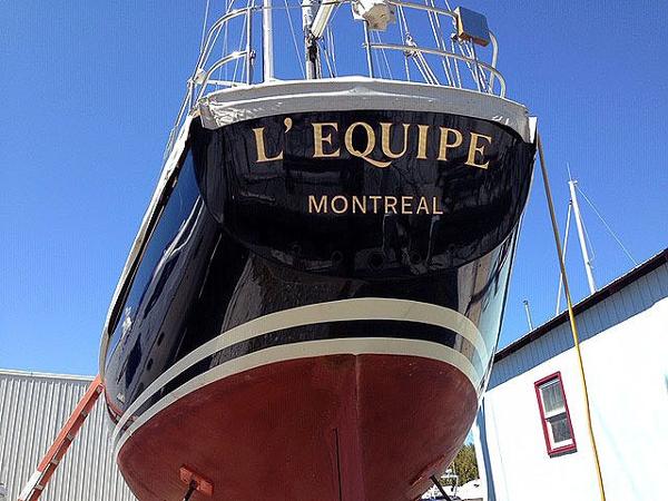 The image shows the stern of a boat named "L'EQUIPE" from Montreal.