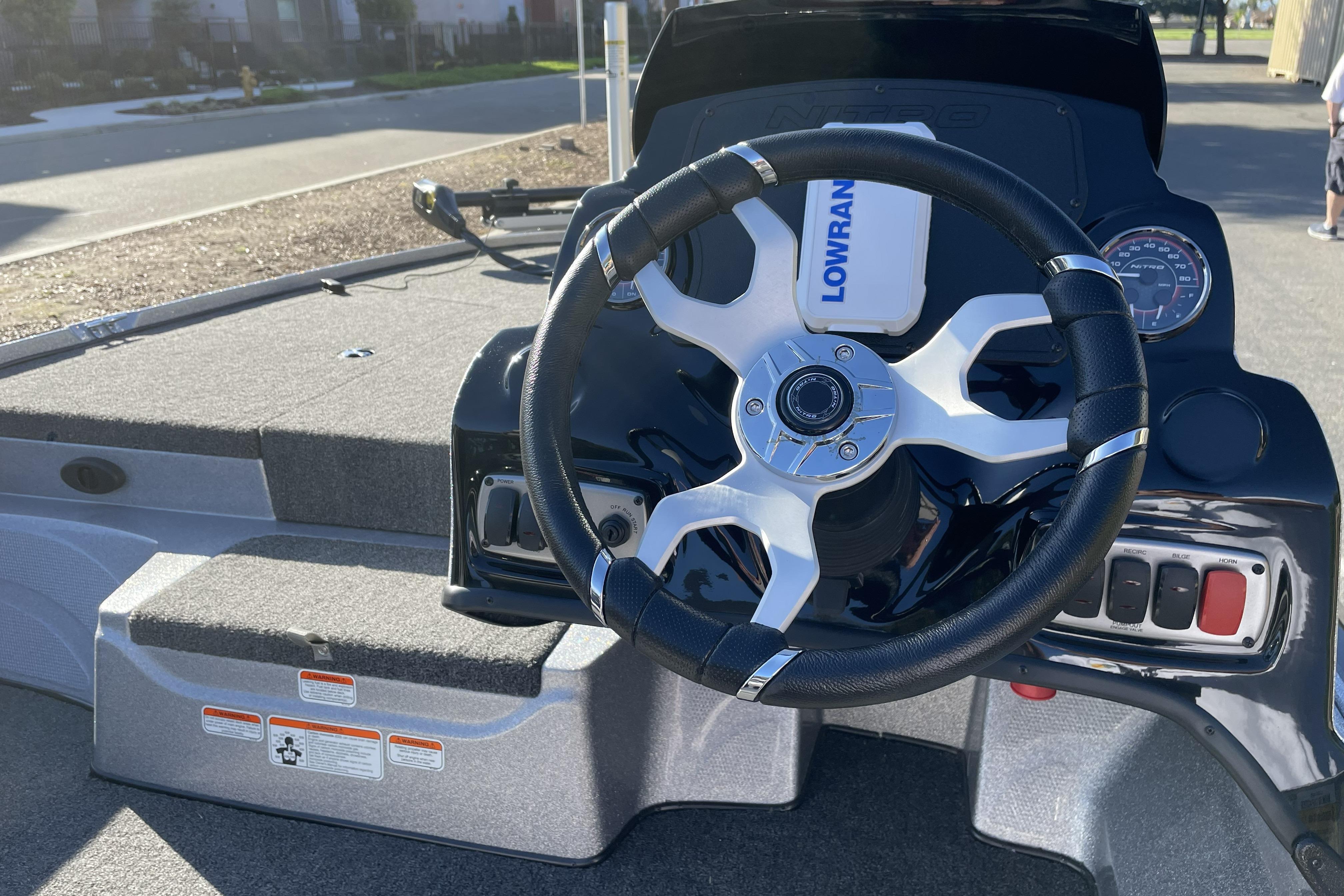 Steering console of a 2026 Nitro Z17 boat with Lowrance electronics.