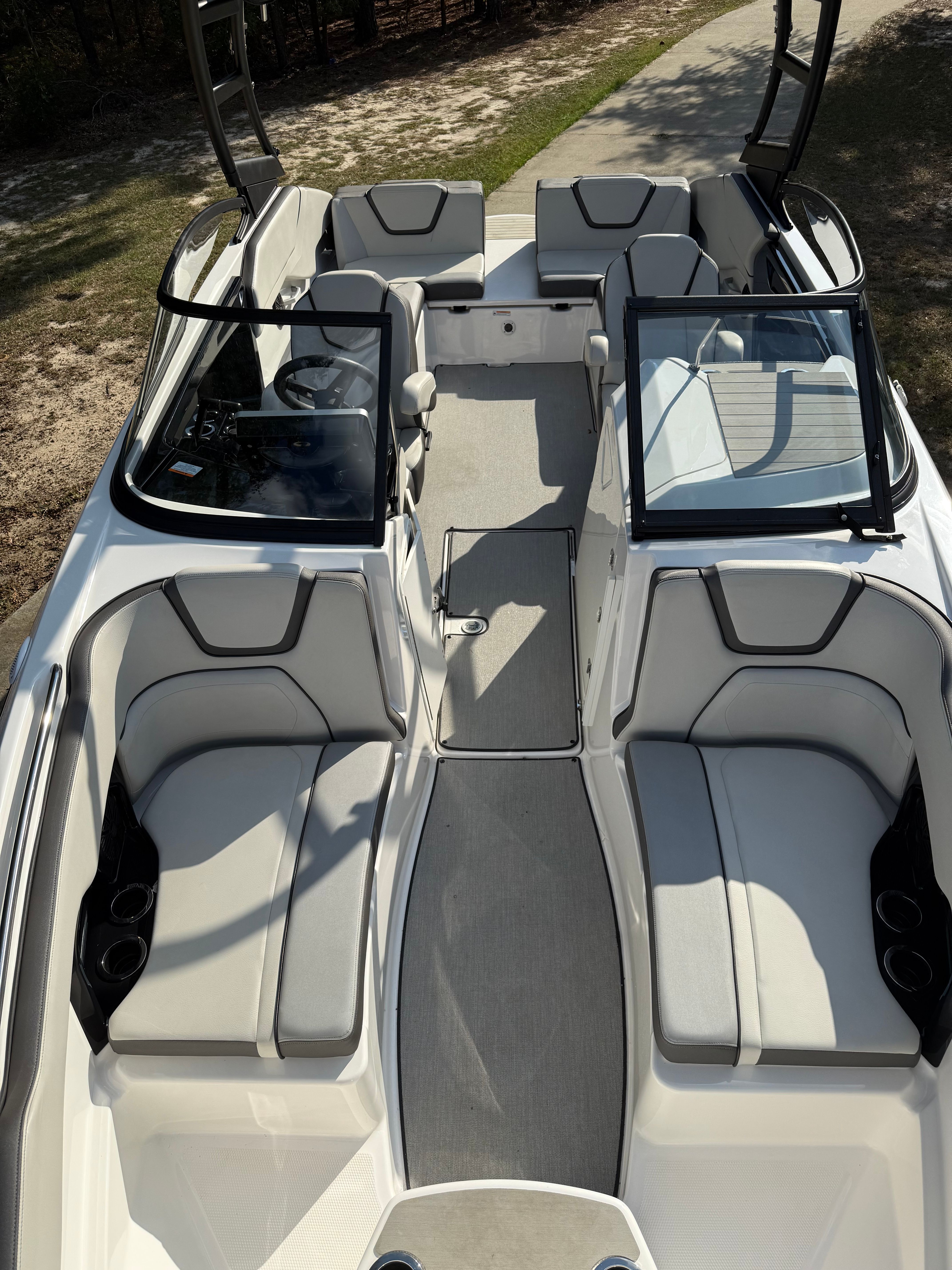 Interior view of a 2021 Yamaha AR250 boat with gray seating.
