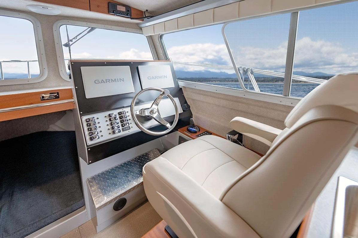 Interior of 2026 KingFisher 3225 GFX Offshore boat with Garmin navigation system.
