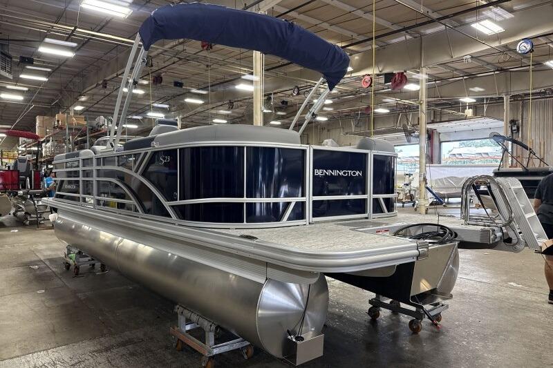 2026 Bennington 23 SSRSF pontoon boat in a factory setting.
