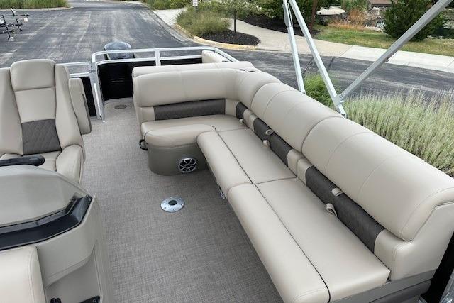 2025 Sun Tracker Sportfish 24 XP3 pontoon boat with spacious seating and modern design.