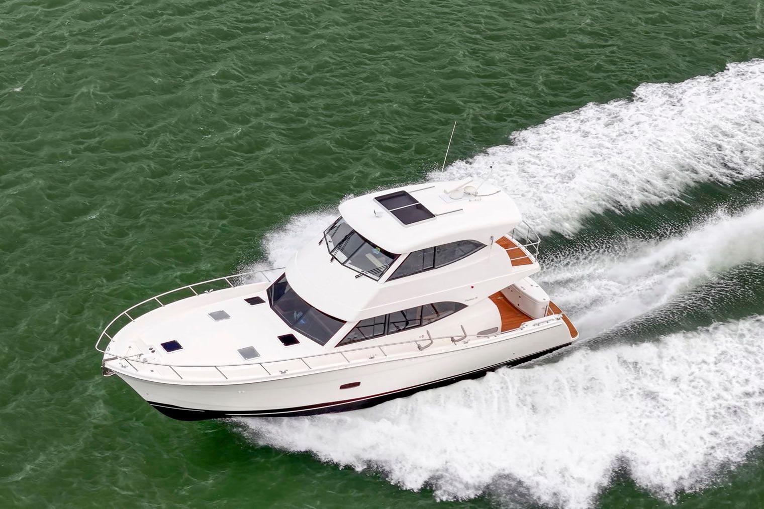 2014 Maritimo M50 yacht cruising on green ocean waters.