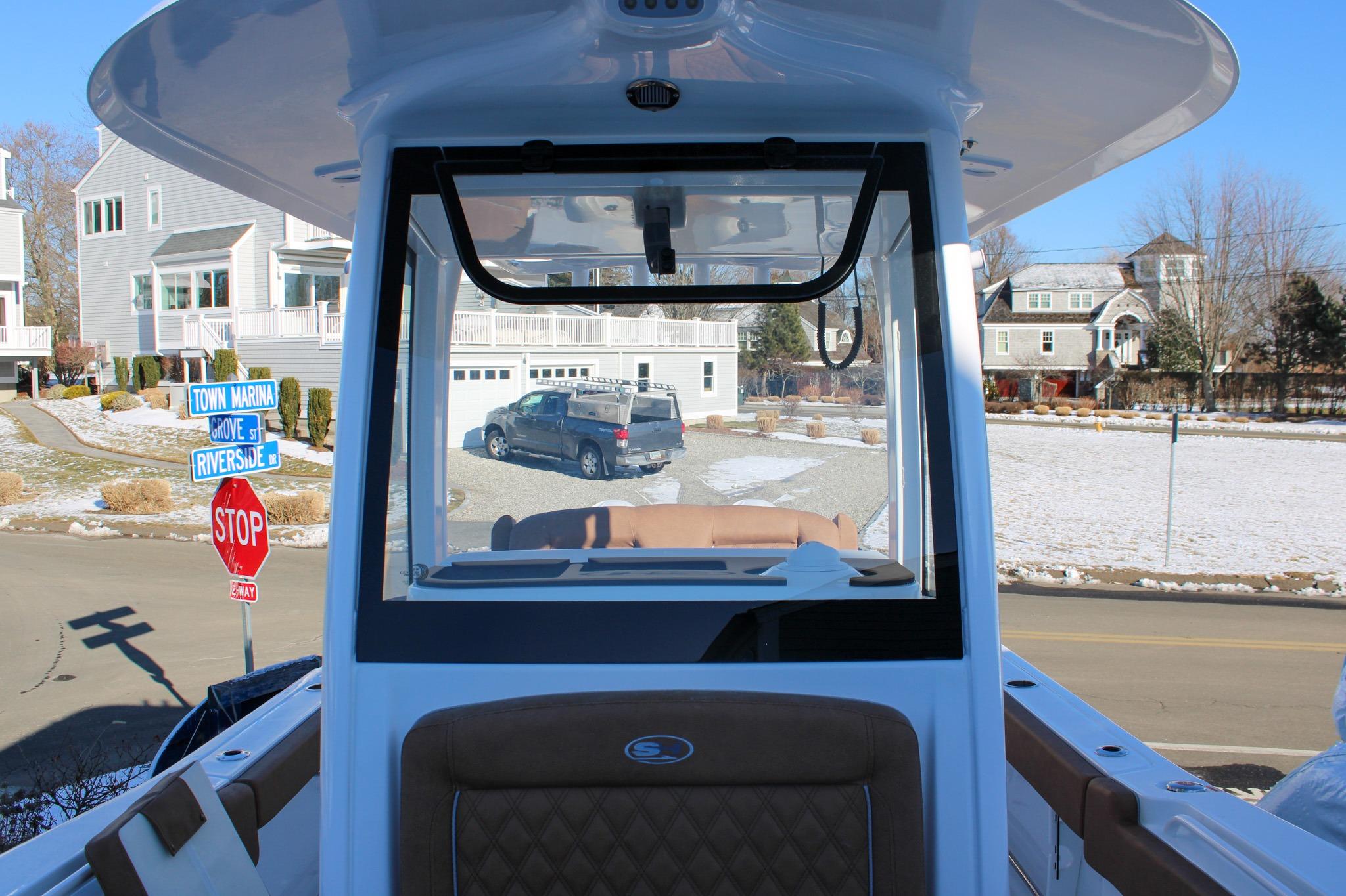 2026 Sea Hunt Gamefish 25 boat interior with street view, stop sign, and residential area.