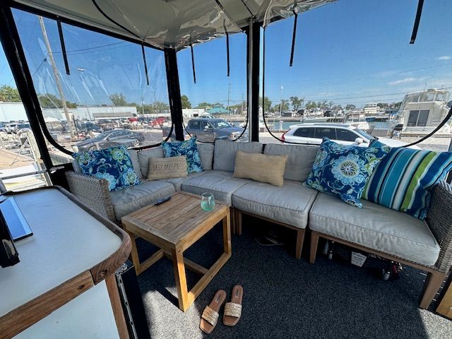 Interior of Carver 3807 yacht with cozy seating, 1988 model.