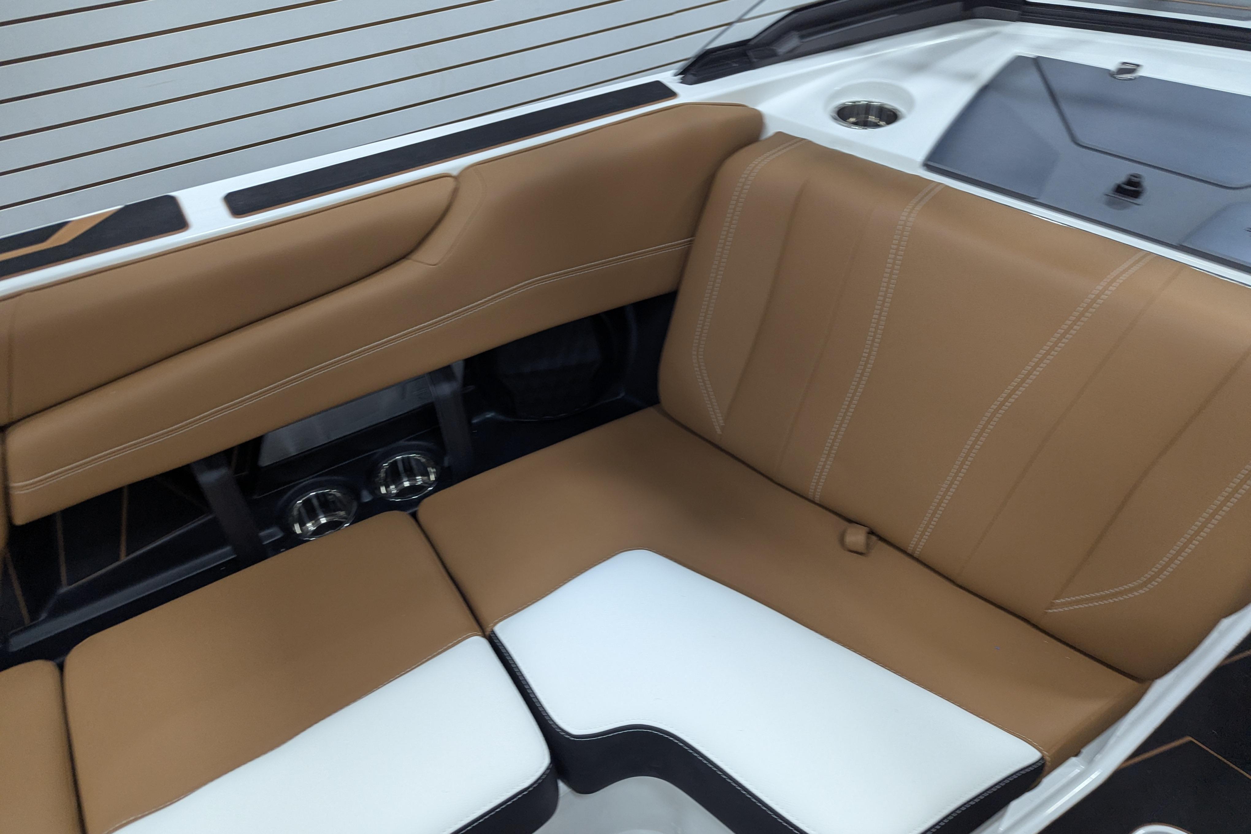 2026 Malibu Wakesetter 21 LX interior with tan and white seating, modern design.