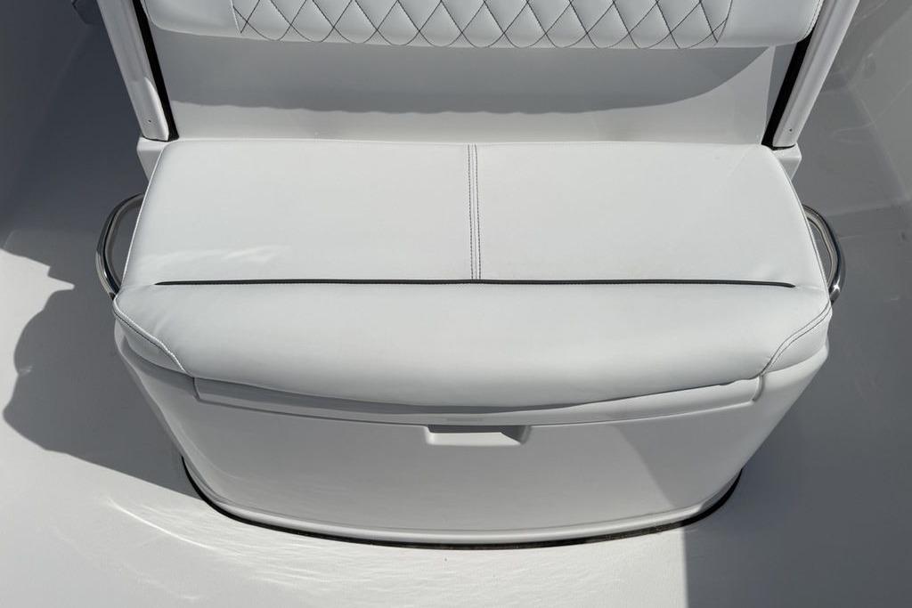 2026 Sportsman Open 252 Center Console boat seat, white upholstery with diamond stitching.