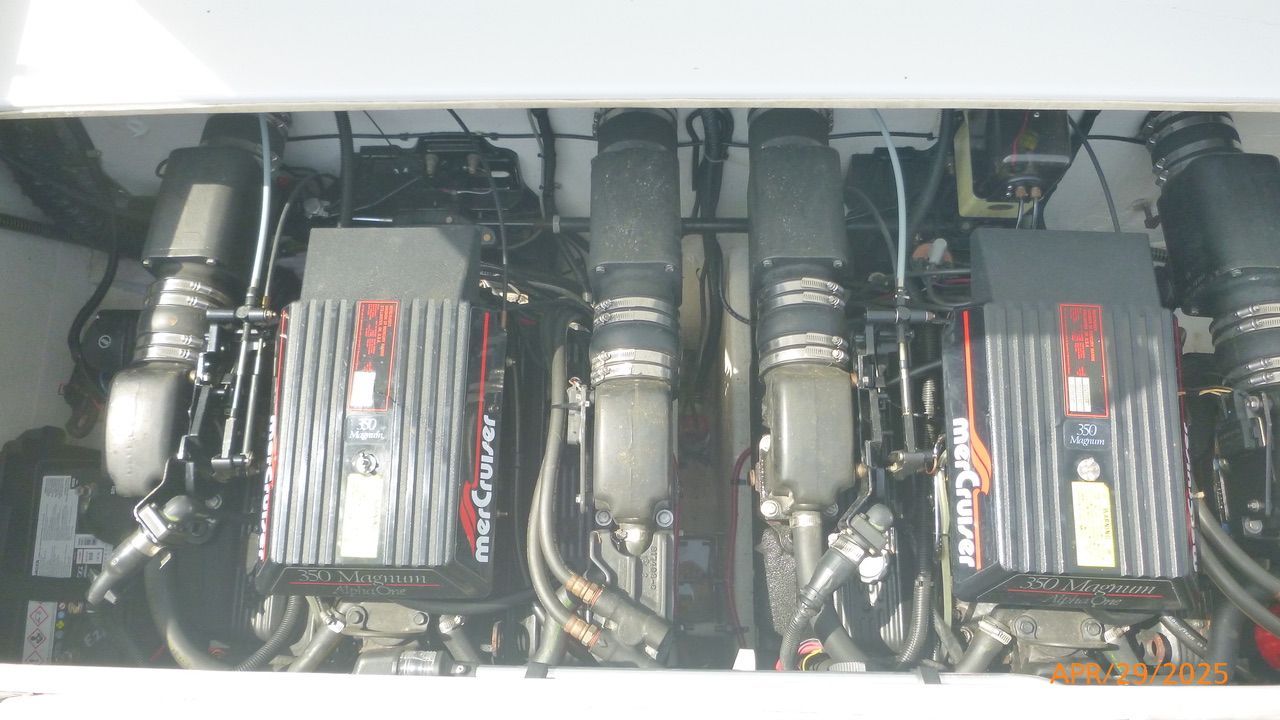 Two powerful MerCruiser engines in the engine compartment of a 1992 Powerquest 270 Laser.