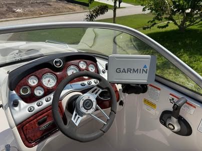Interior of 2011 Tahoe 216 WT boat with Garmin navigation system.