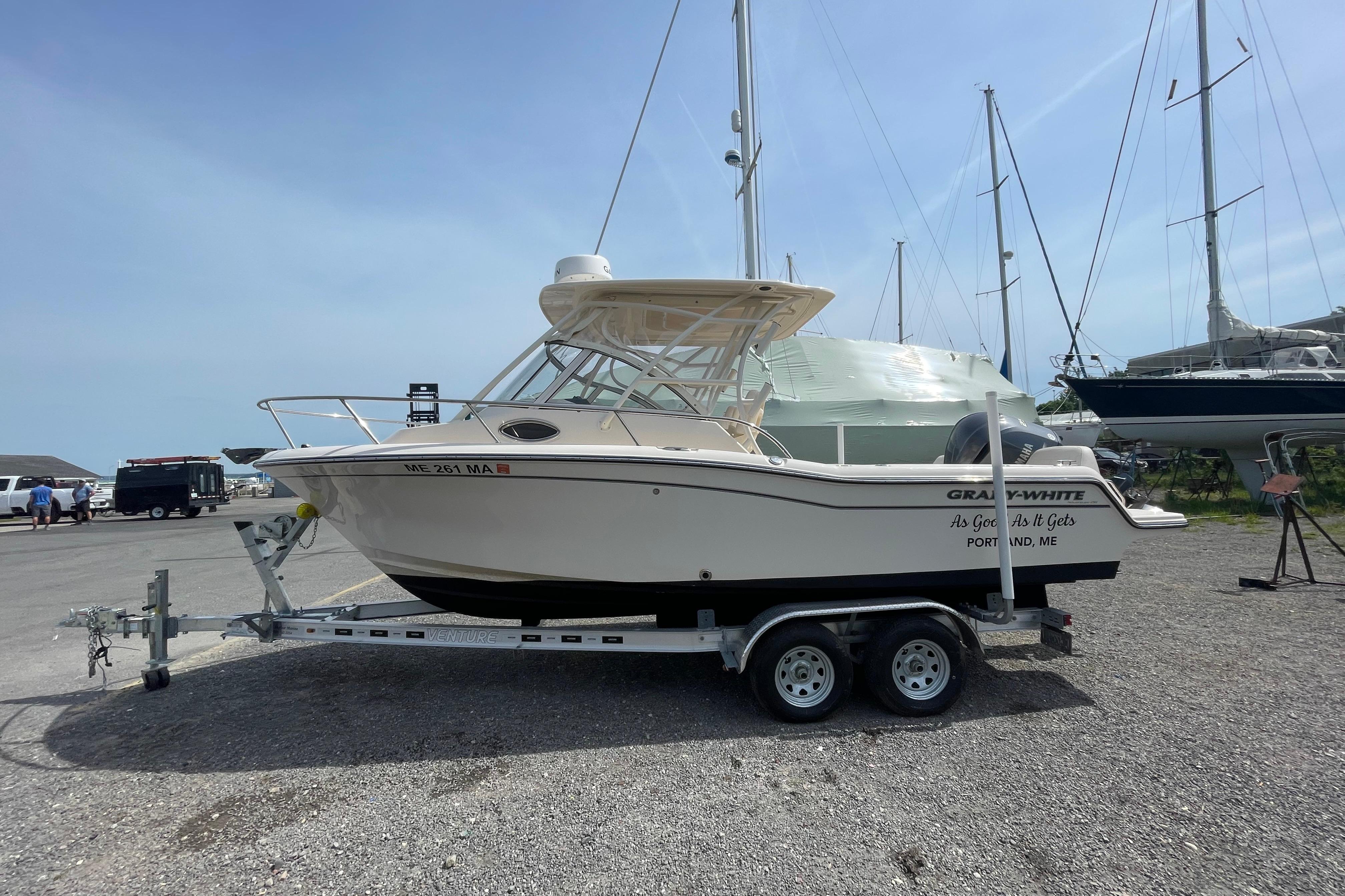 2024 Grady-White Adventure 218 boat on trailer in a marina setting.