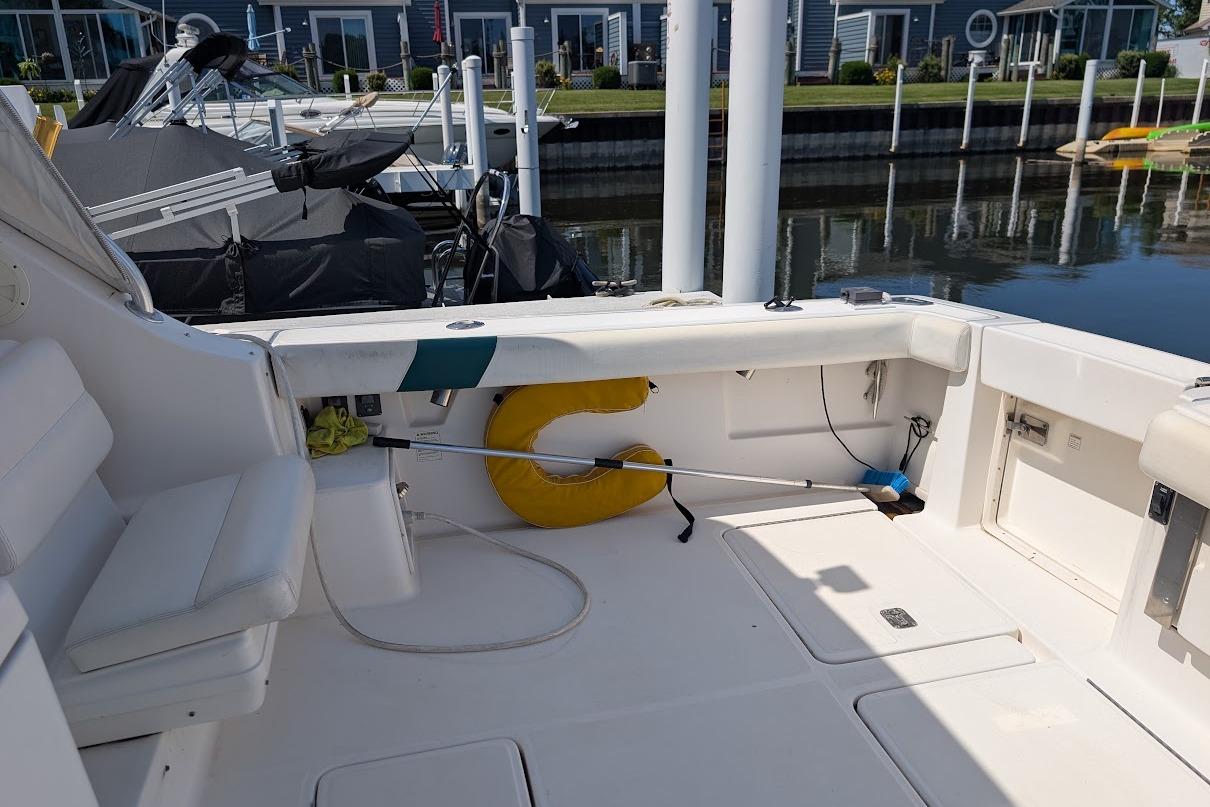 Interior view of a 2000 Pursuit 3400 Express boat docked at a marina.