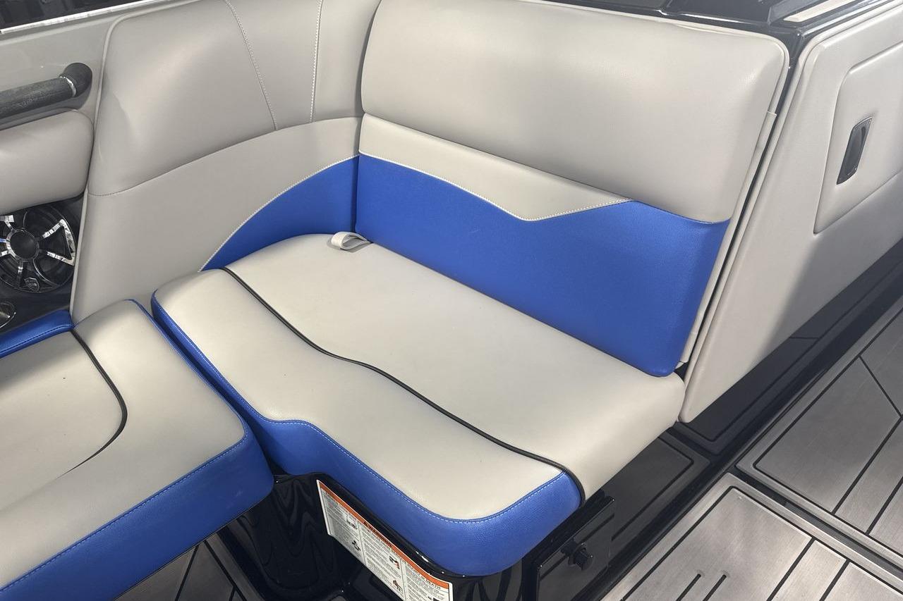 2023 Moomba Mojo boat interior with gray and blue seating.
