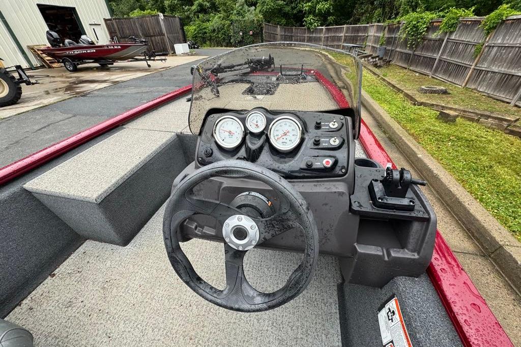 2022 Tracker Pro 170 boat dashboard with steering wheel and gauges.