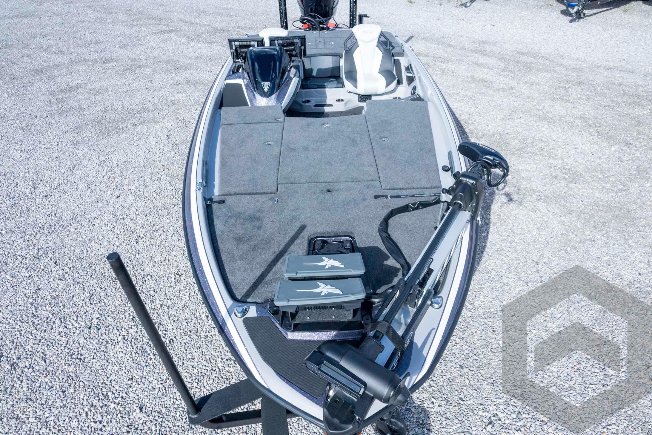 2026 Skeeter FXR20 FLEX boat on gravel, featuring advanced deck and seating design.