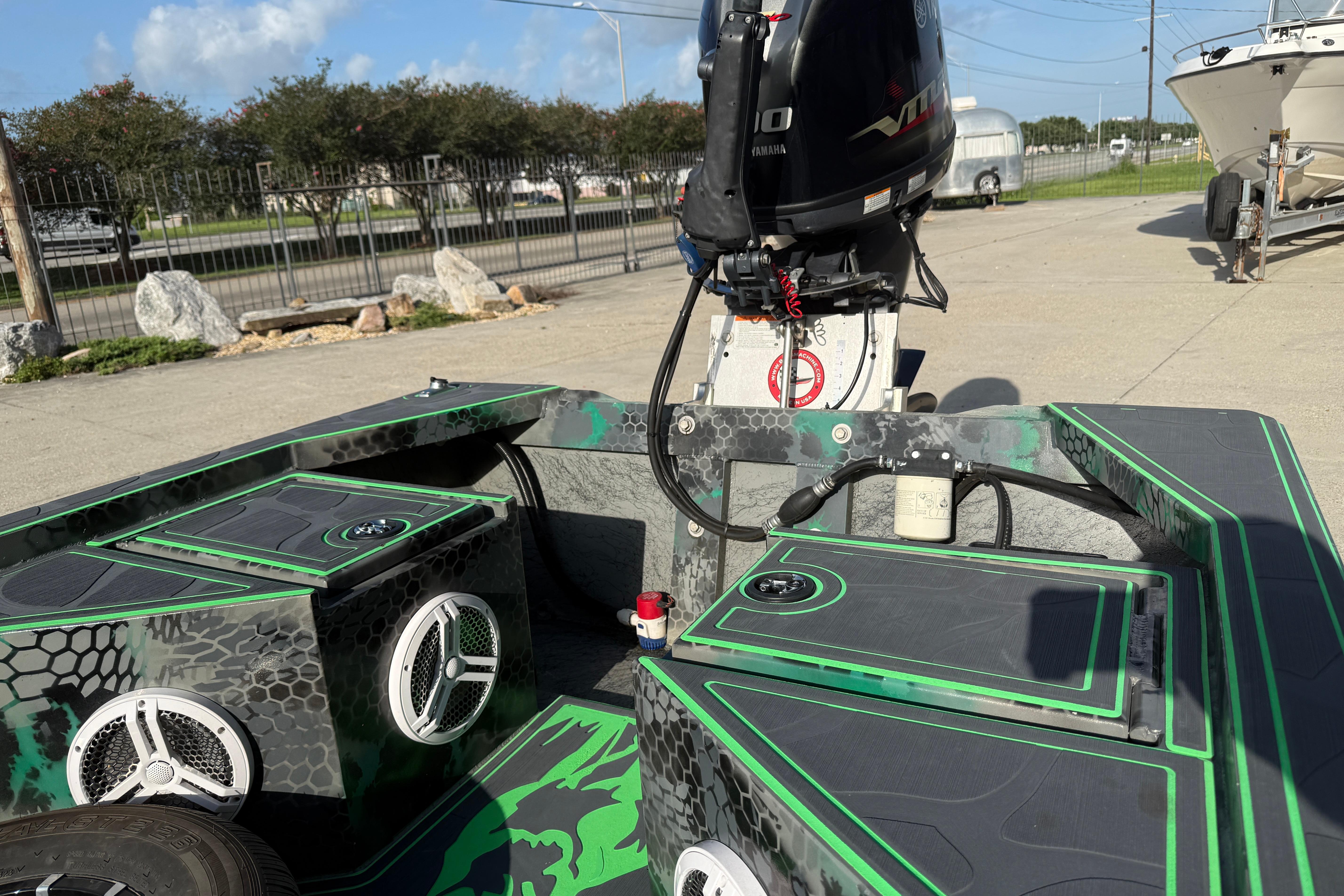 Custom Rene Gros 20x48 boat, 2024 model, with Yamaha motor and stylish green-black design.