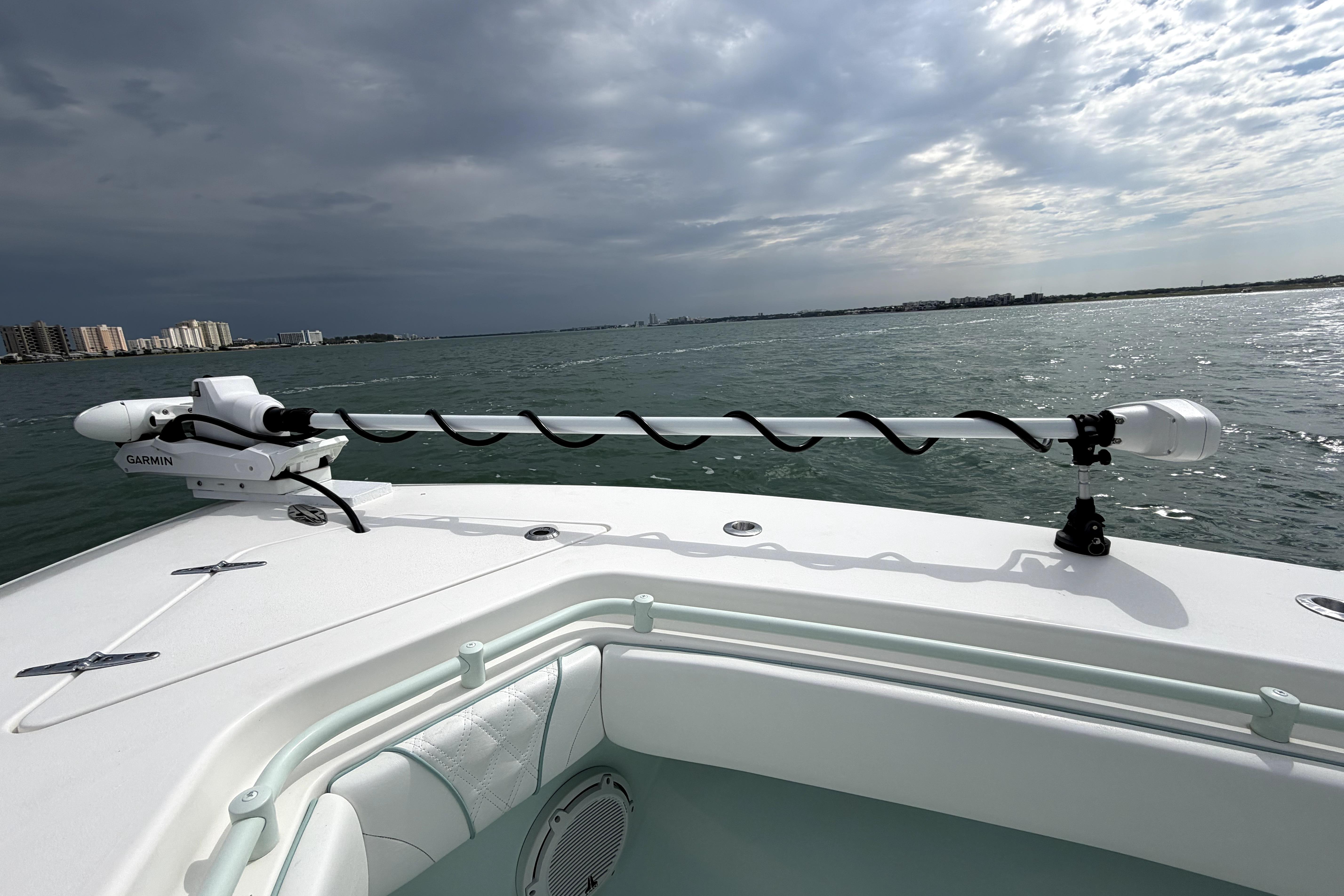 2019 Contender 30 ST boat with Garmin equipment on open water under cloudy sky.