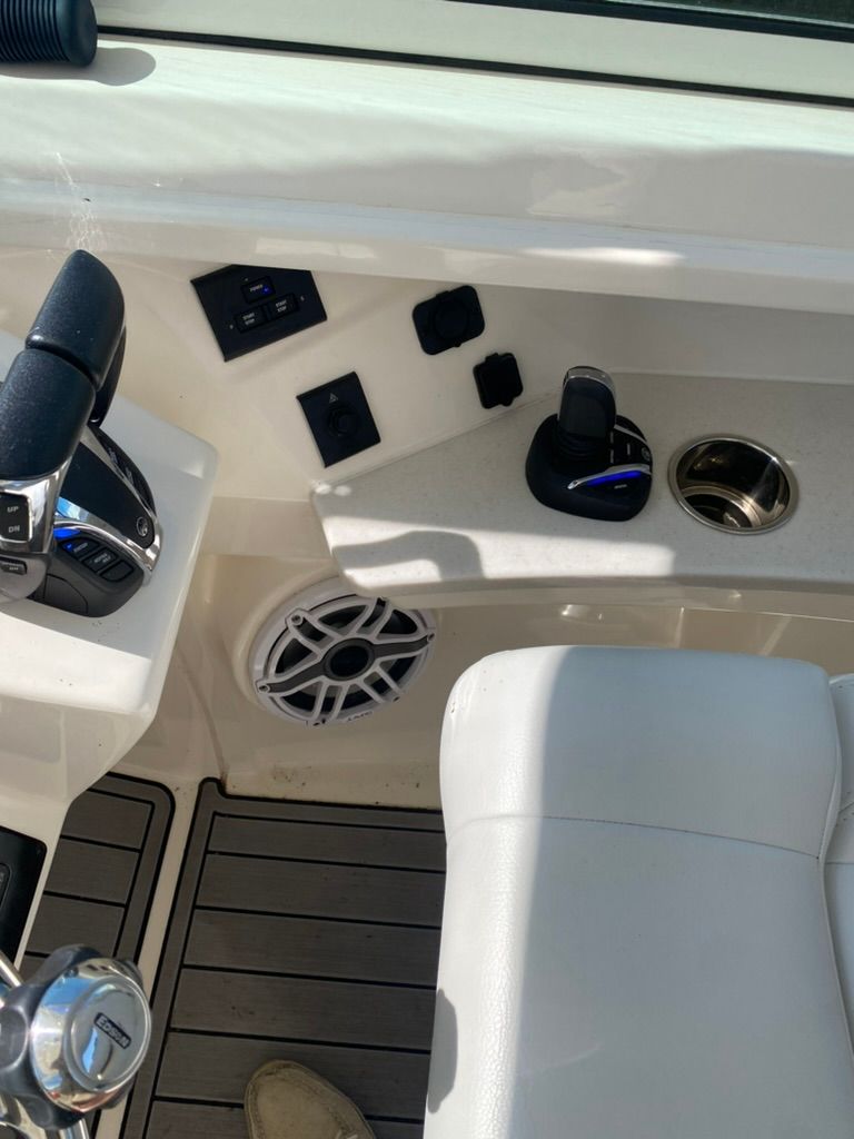 Interior of Cobia 330 boat, control console and controls, year 2023.