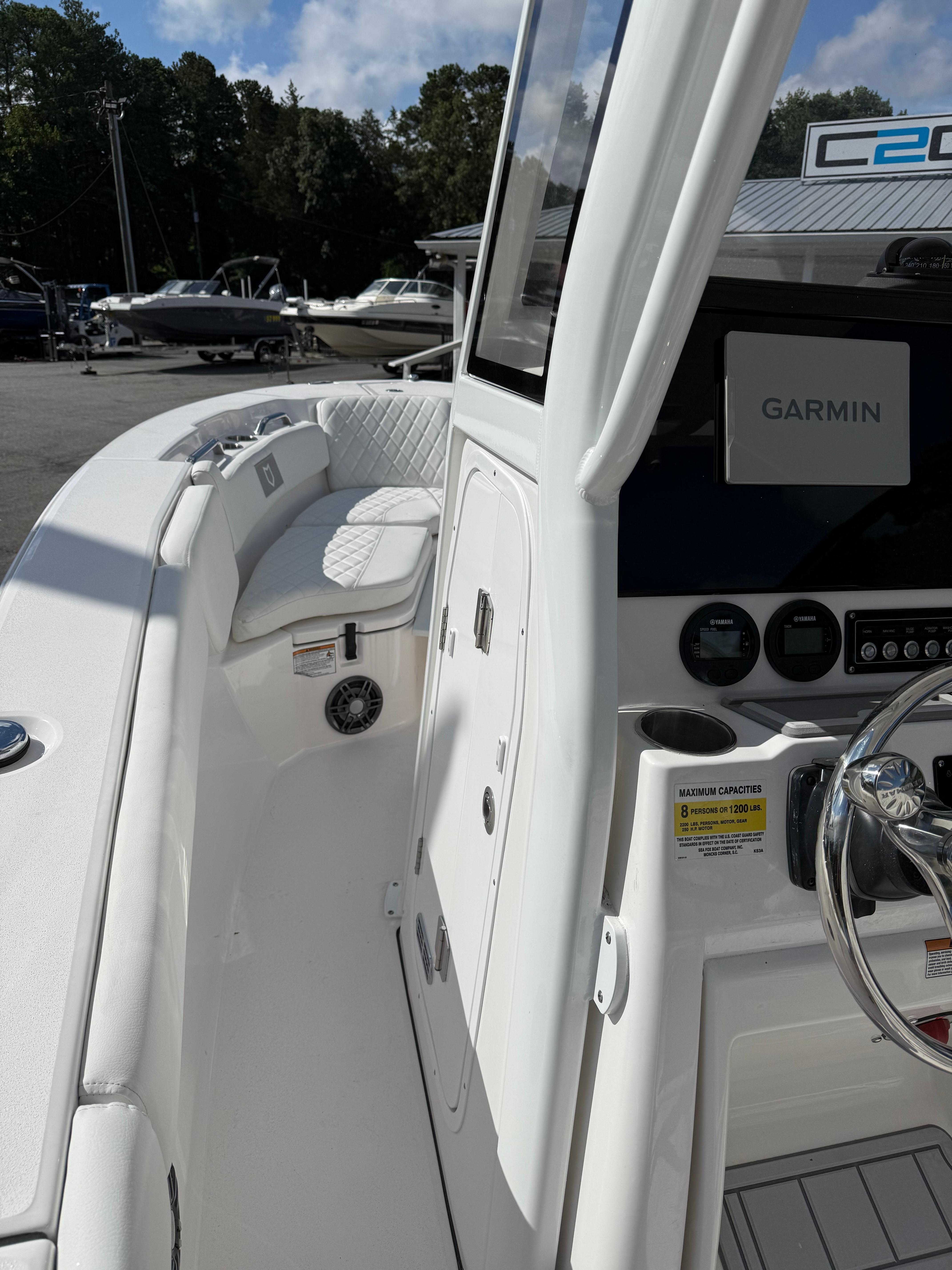 2026 Sea Fox 228 Commander boat interior with Garmin navigation system and seating.