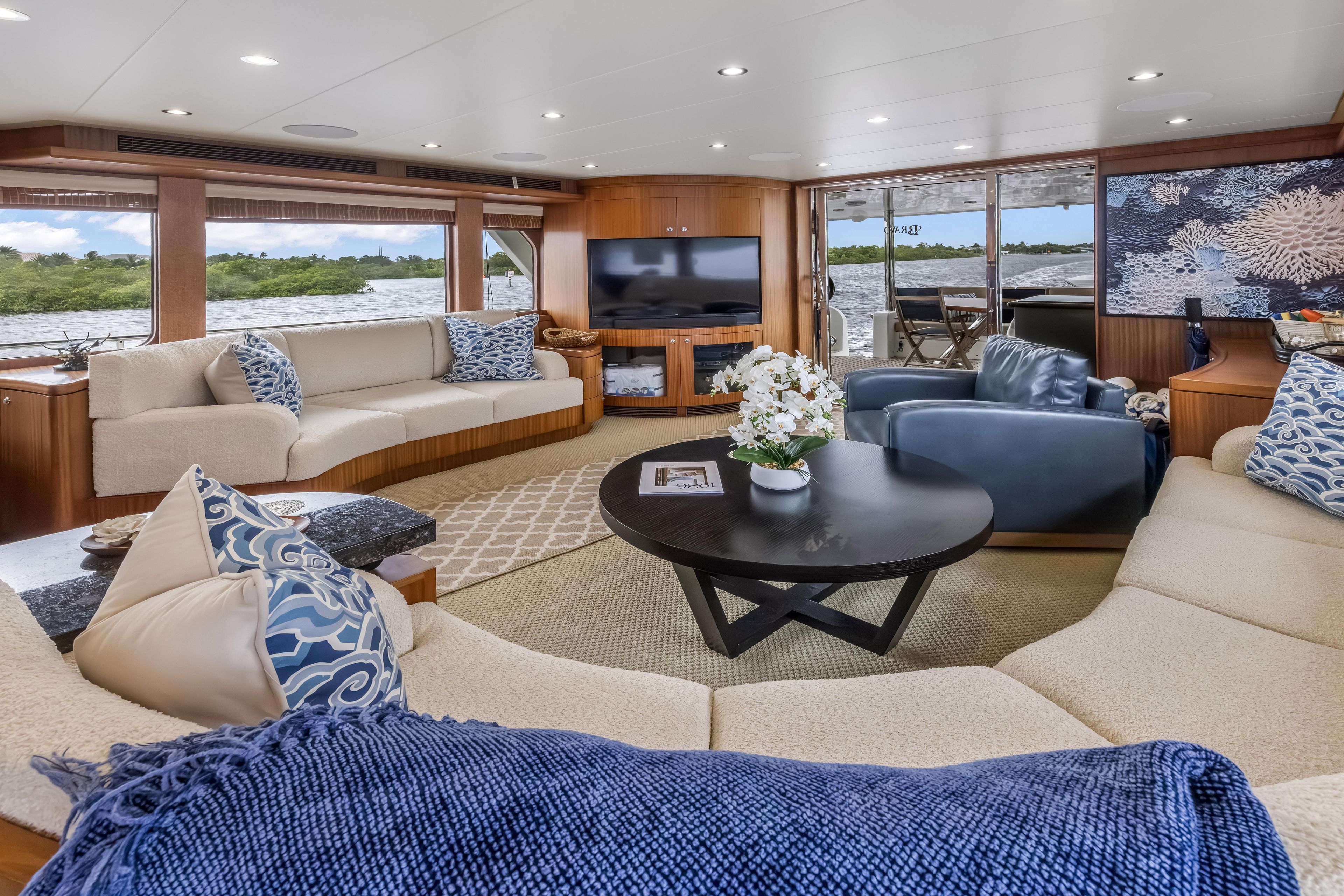 Luxurious interior of 2012 Cheoy Lee 84 Bravo yacht with elegant seating and decor.
