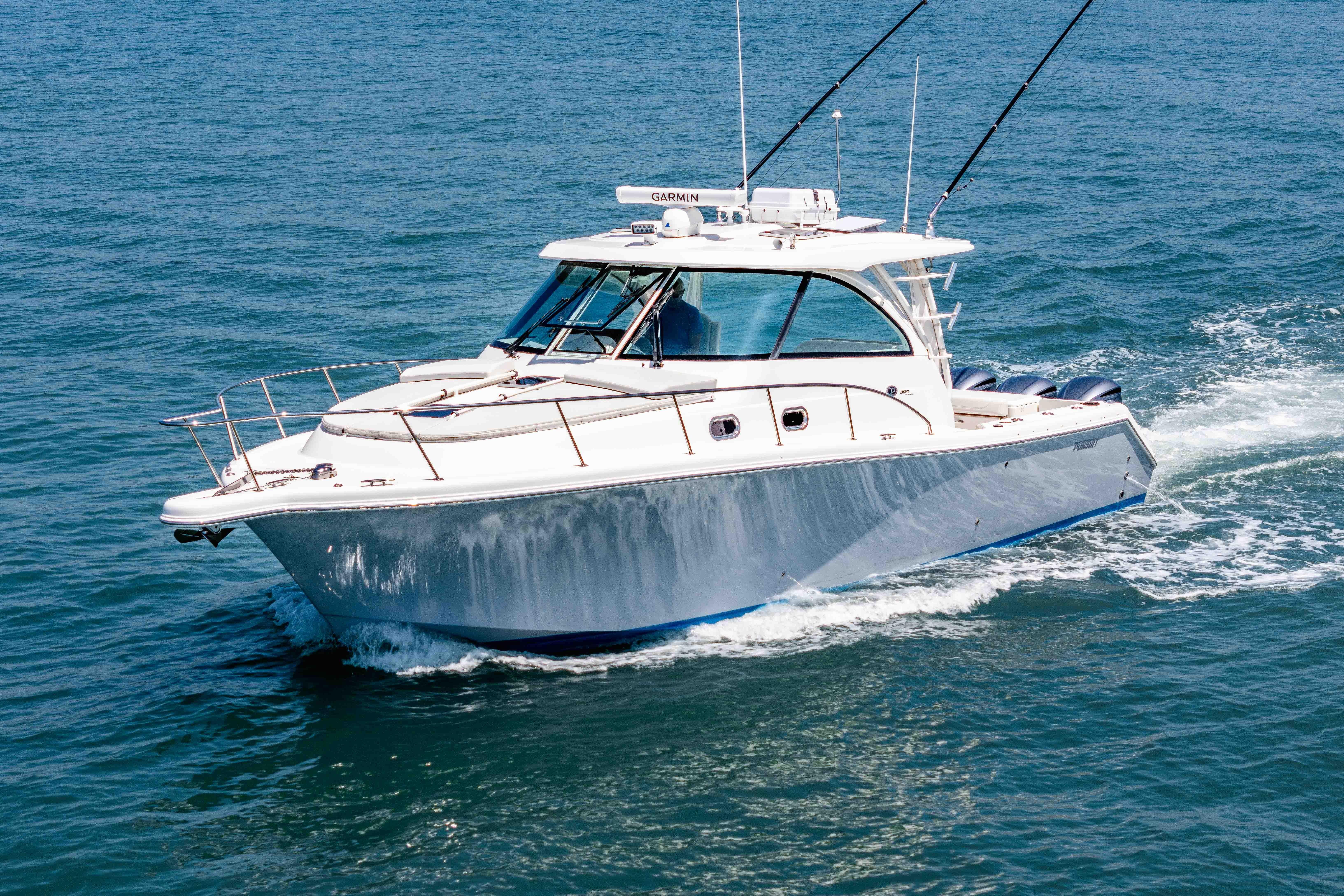 2022 Pursuit OS 385 Offshore boat cruising on open water.