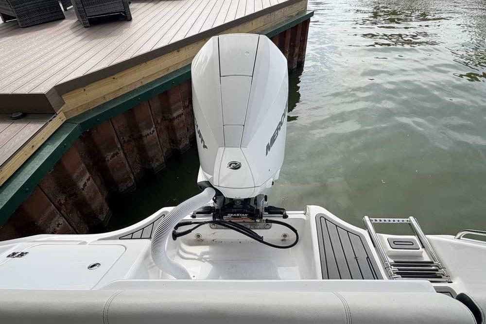 2024 Tidewater 232 LXF boat with Mercury outboard engine at dockside.