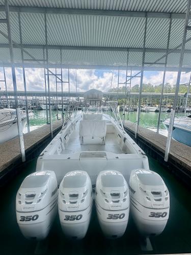 2008 SeaVee 390B boat with four 350 horsepower engines docked in a marina.