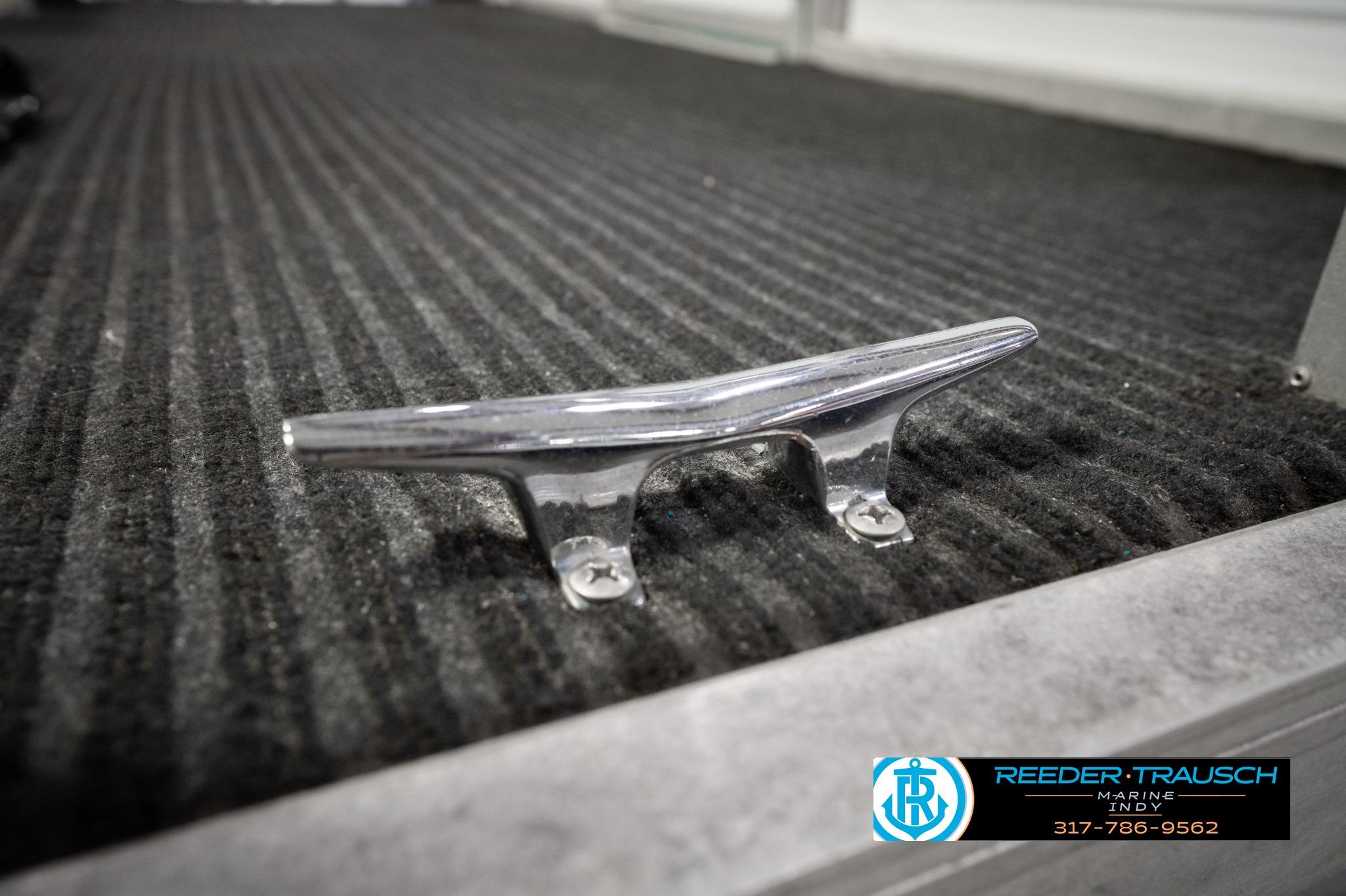 Chrome boat cleat on carpeted deck, Godfrey Sweetwater 1992 model.