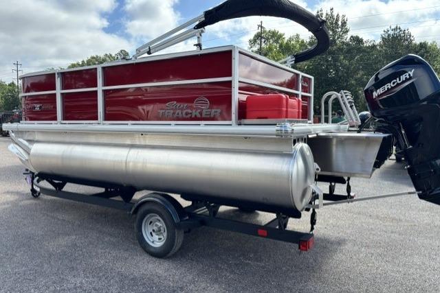 2026 Sun Tracker Party Barge 16 DLX pontoon boat with Mercury outboard motor on trailer.