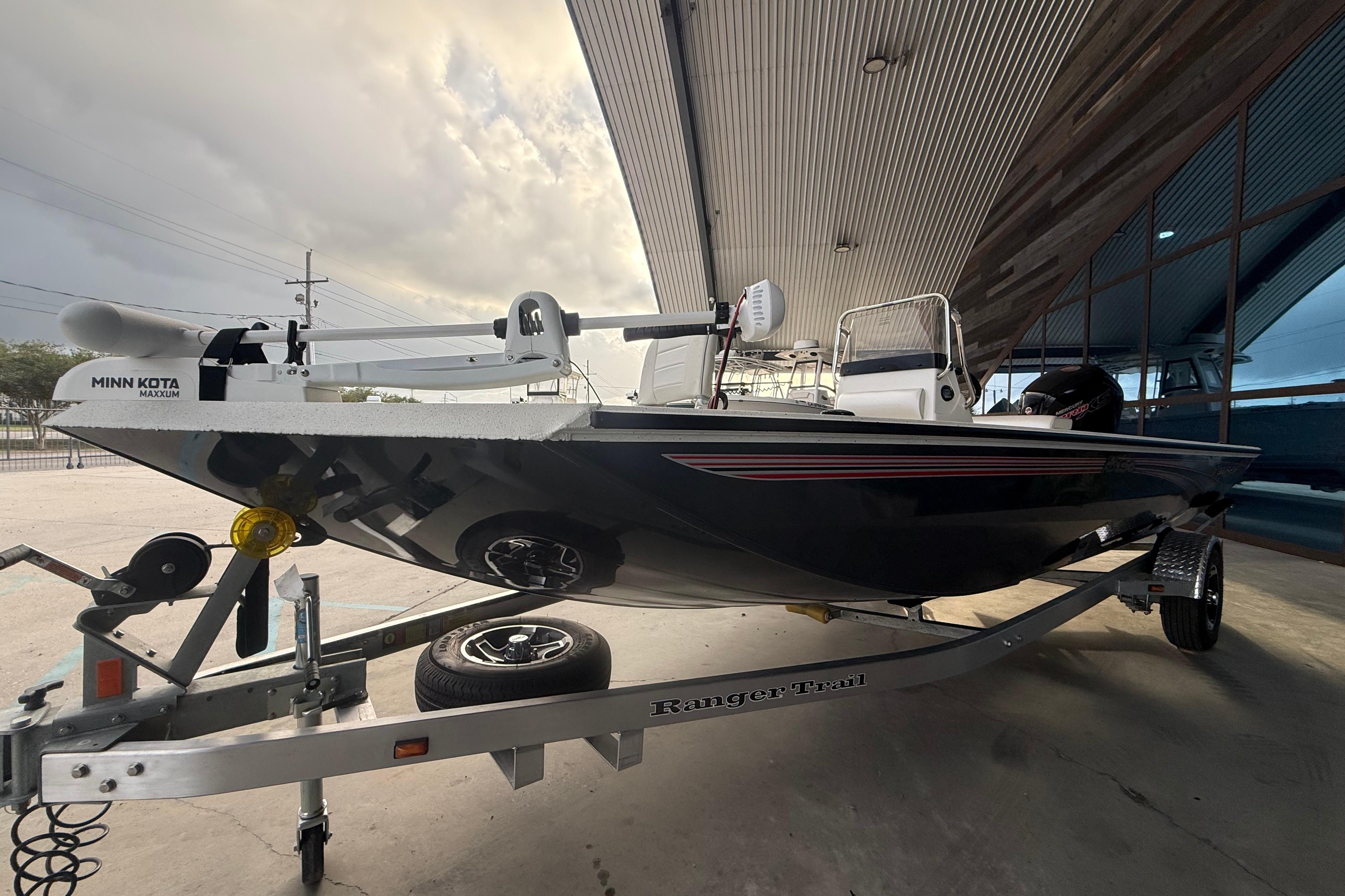 2026 Ranger RB190 boat on trailer under a metal roof, featuring Minn Kota Maxxum motor.