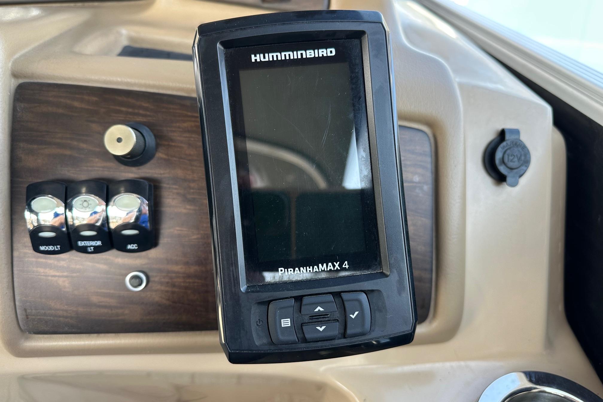 Humminbird PiranhaMAX 4 fish finder on 2017 Bennington 22 GPD boat dashboard.