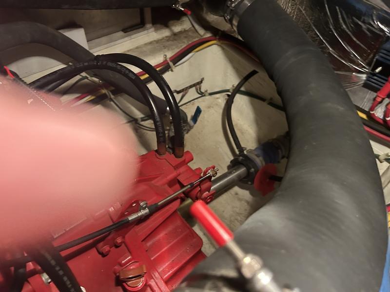 Engine compartment of a 2005 Carver 396 AFT with visible hoses and wiring.