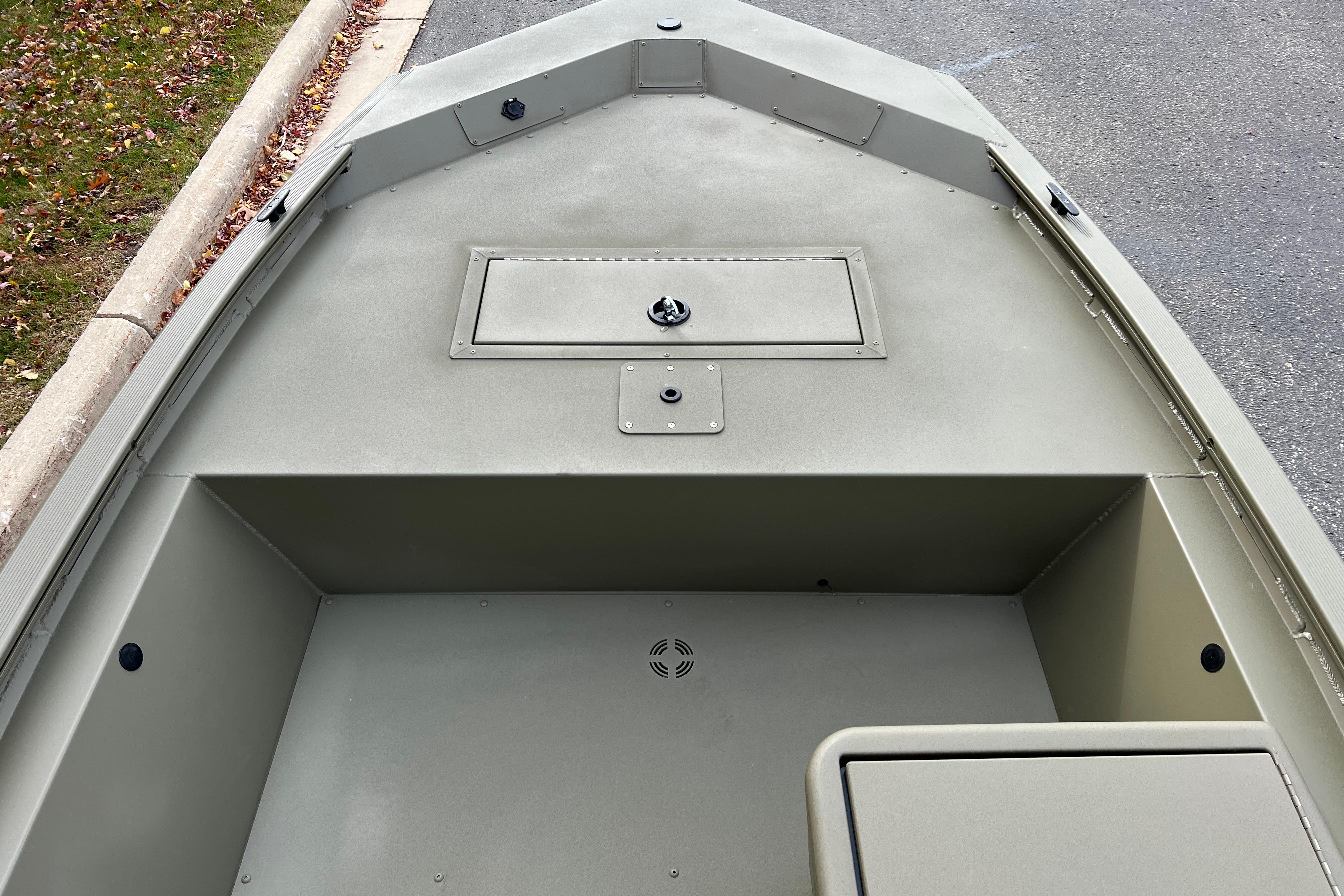 2026 Tracker Grizzly 1648 SC boat interior with storage compartment, viewed from above.