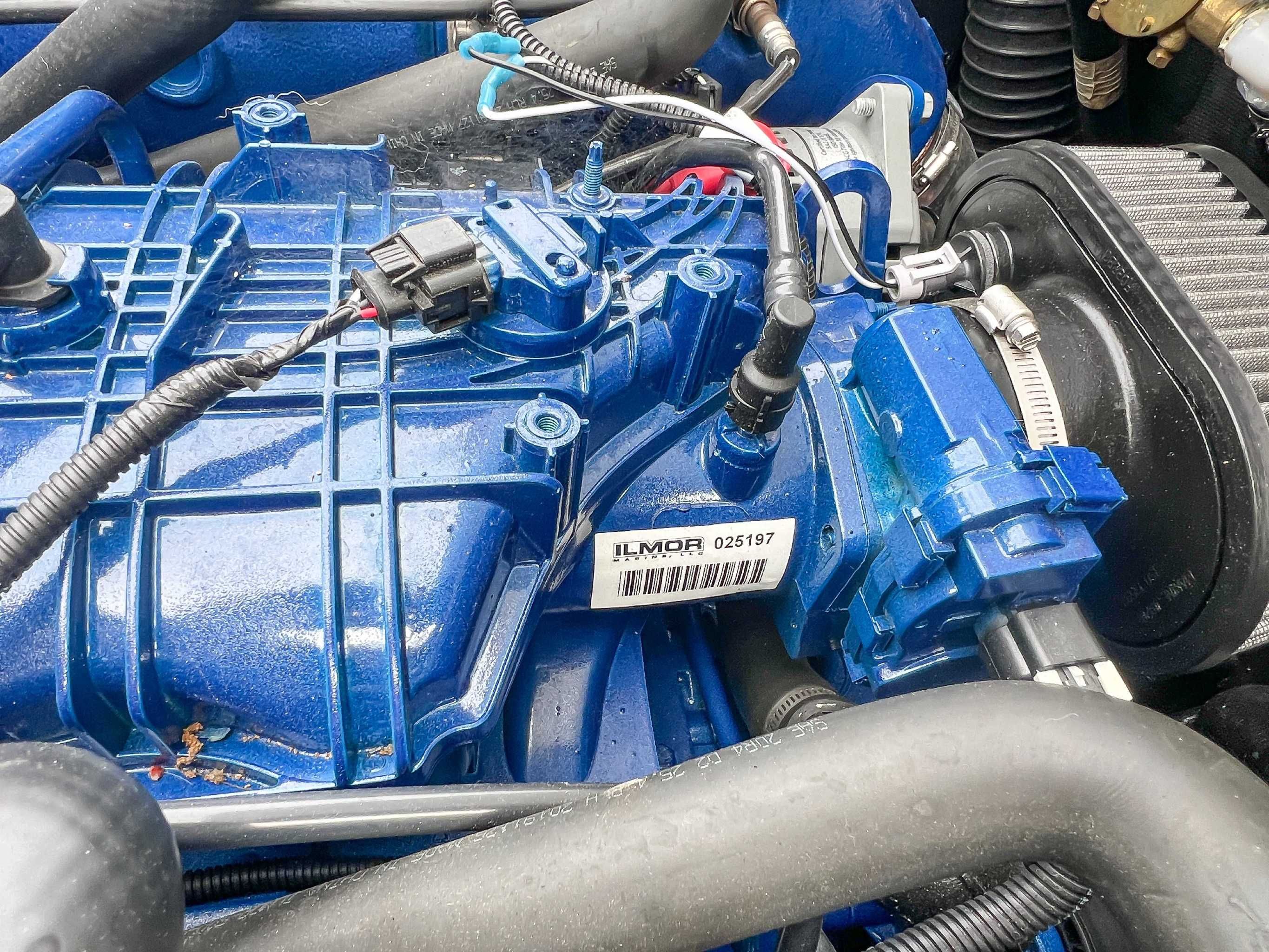 Engine of 2021 MasterCraft XT22 with blue cover.