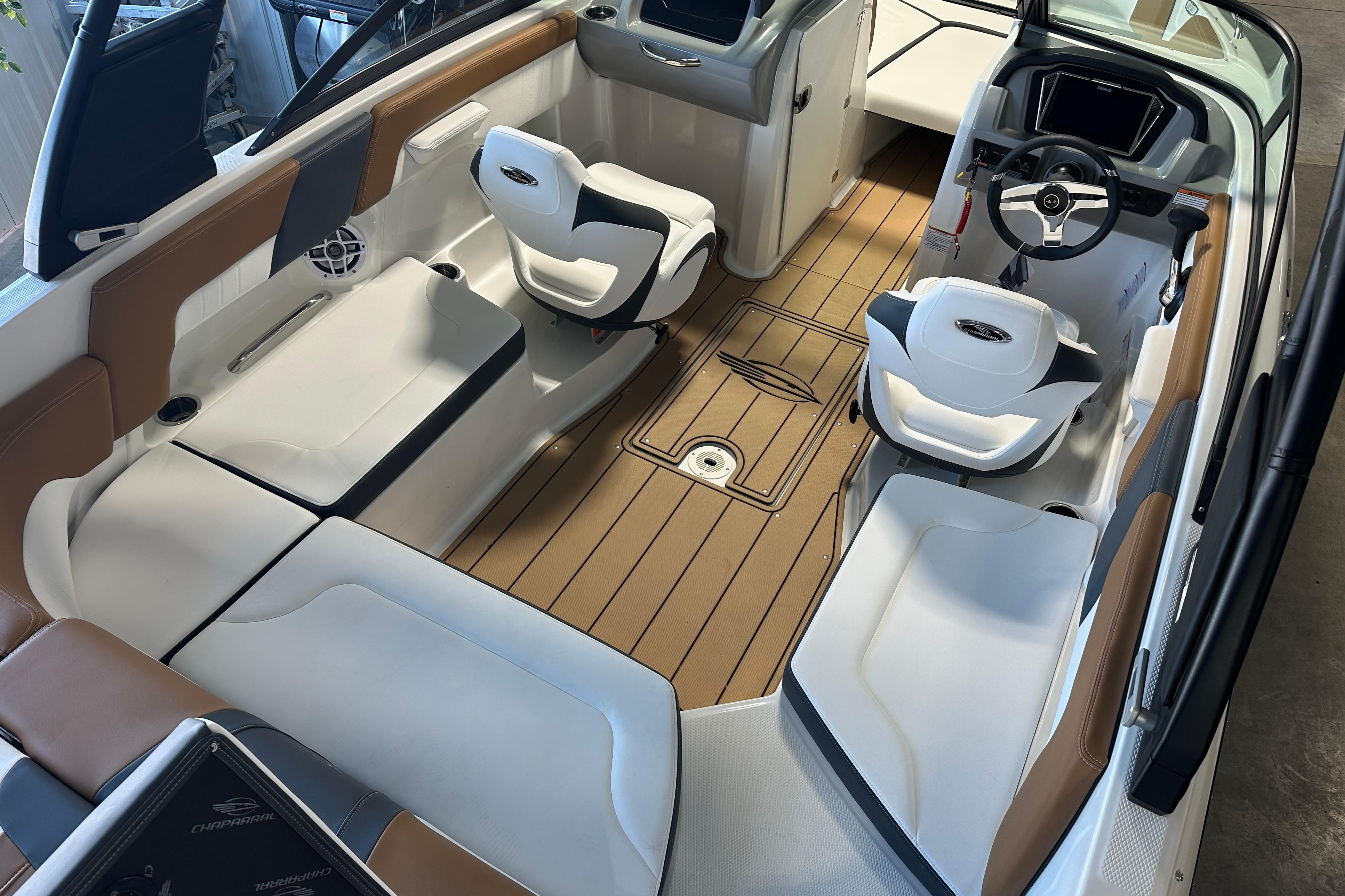 Interior of 2026 Chaparral 23 SSi with modern seating and steering wheel.
