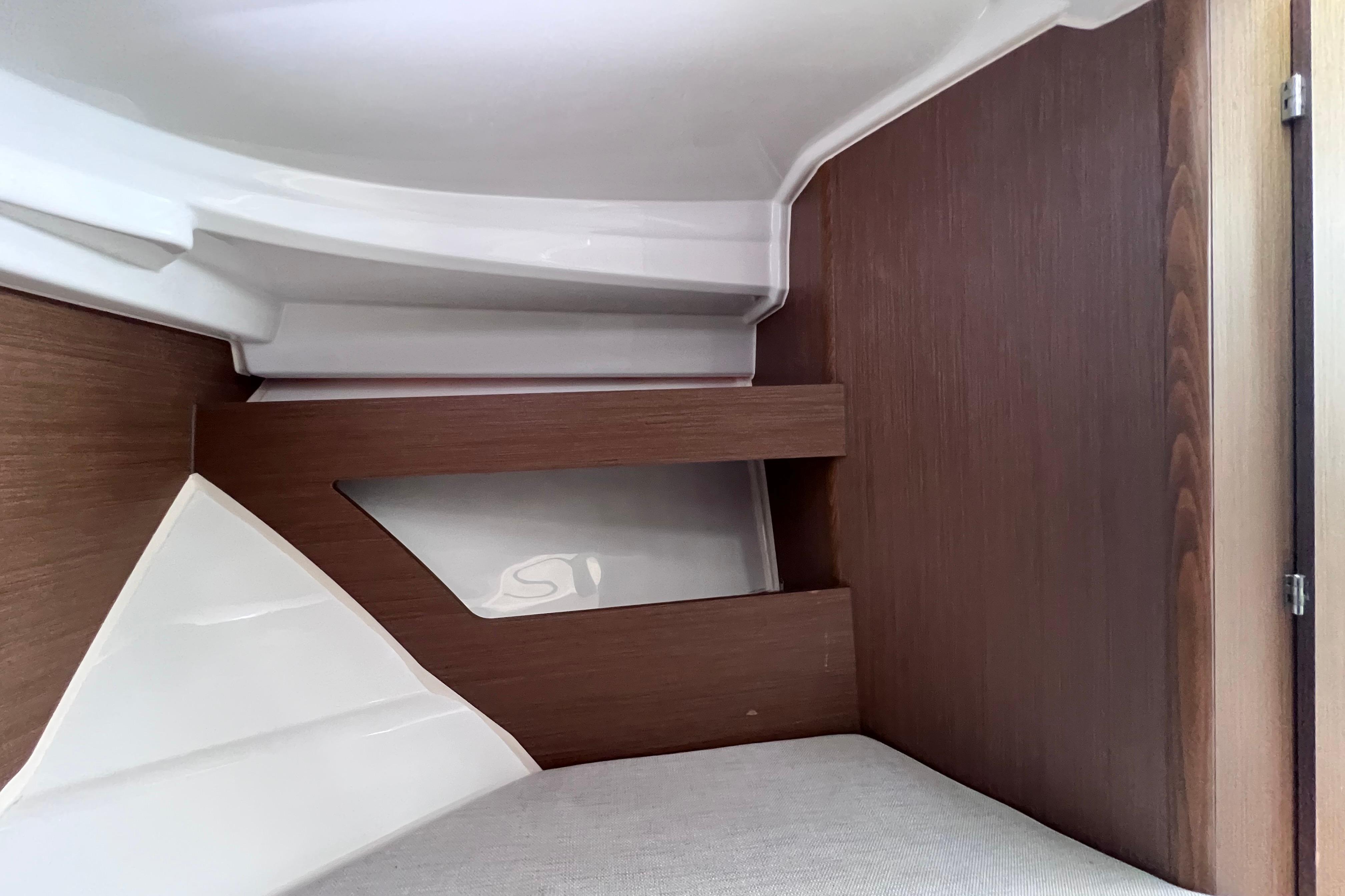 Interior cabin of 2021 Jeanneau NC Weekender 795 Series 2, featuring wood paneling.