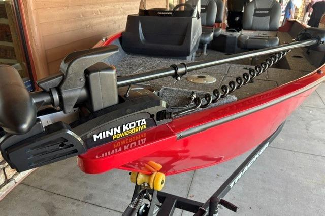 2026 Tracker Pro Guide V-16 SC boat with Minn Kota PowerDrive motor, red exterior.