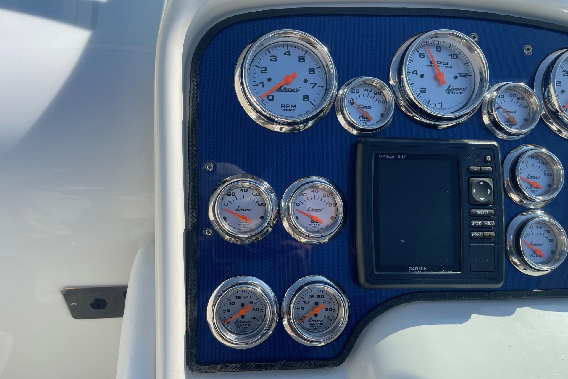 Dashboard of a 2004 Formula 382 FASTech boat with gauges and Garmin GPS.