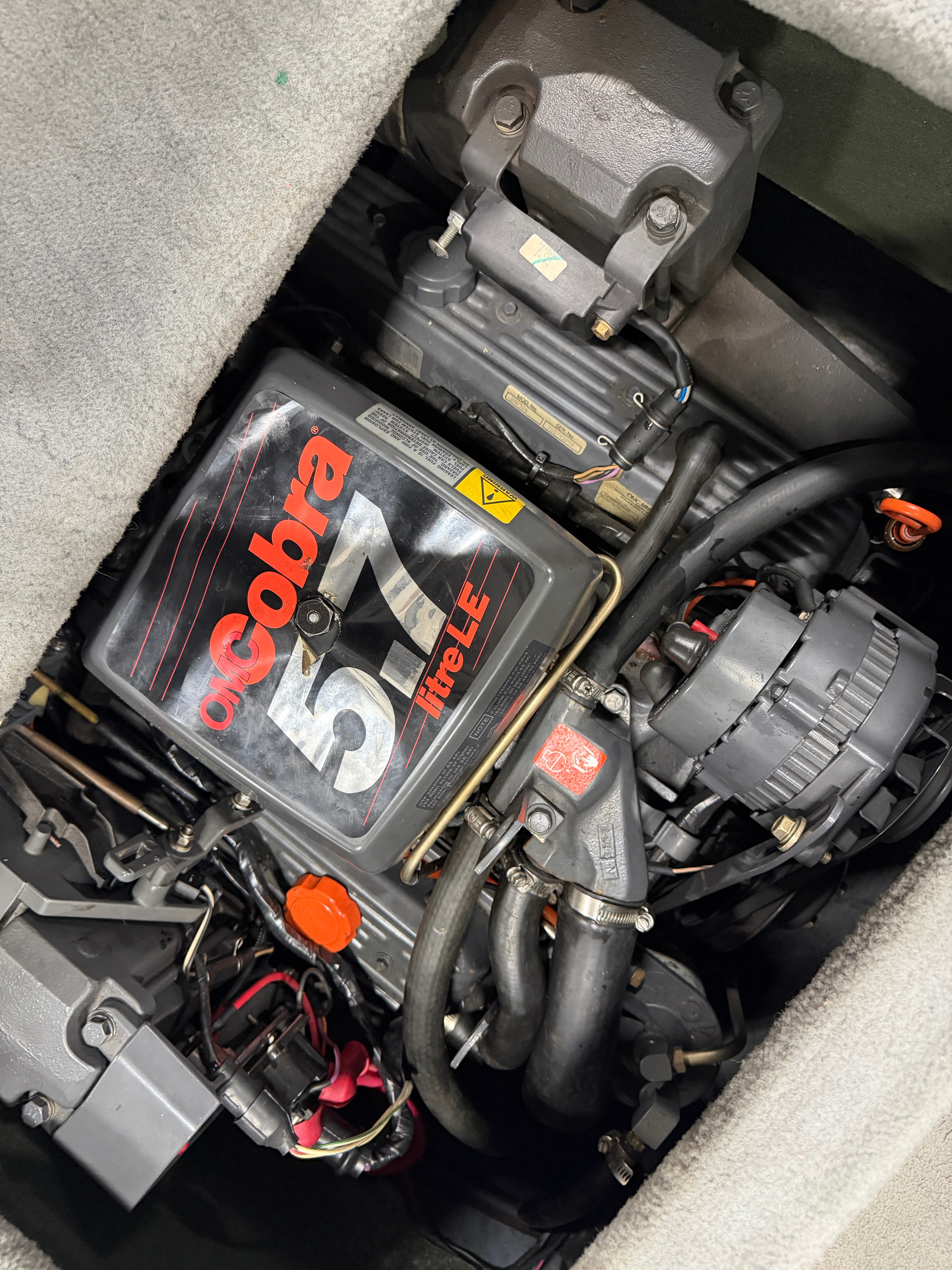 Engine compartment of a 1992 Four Winns 225 Sundowner with a Cobra 5.7 engine.