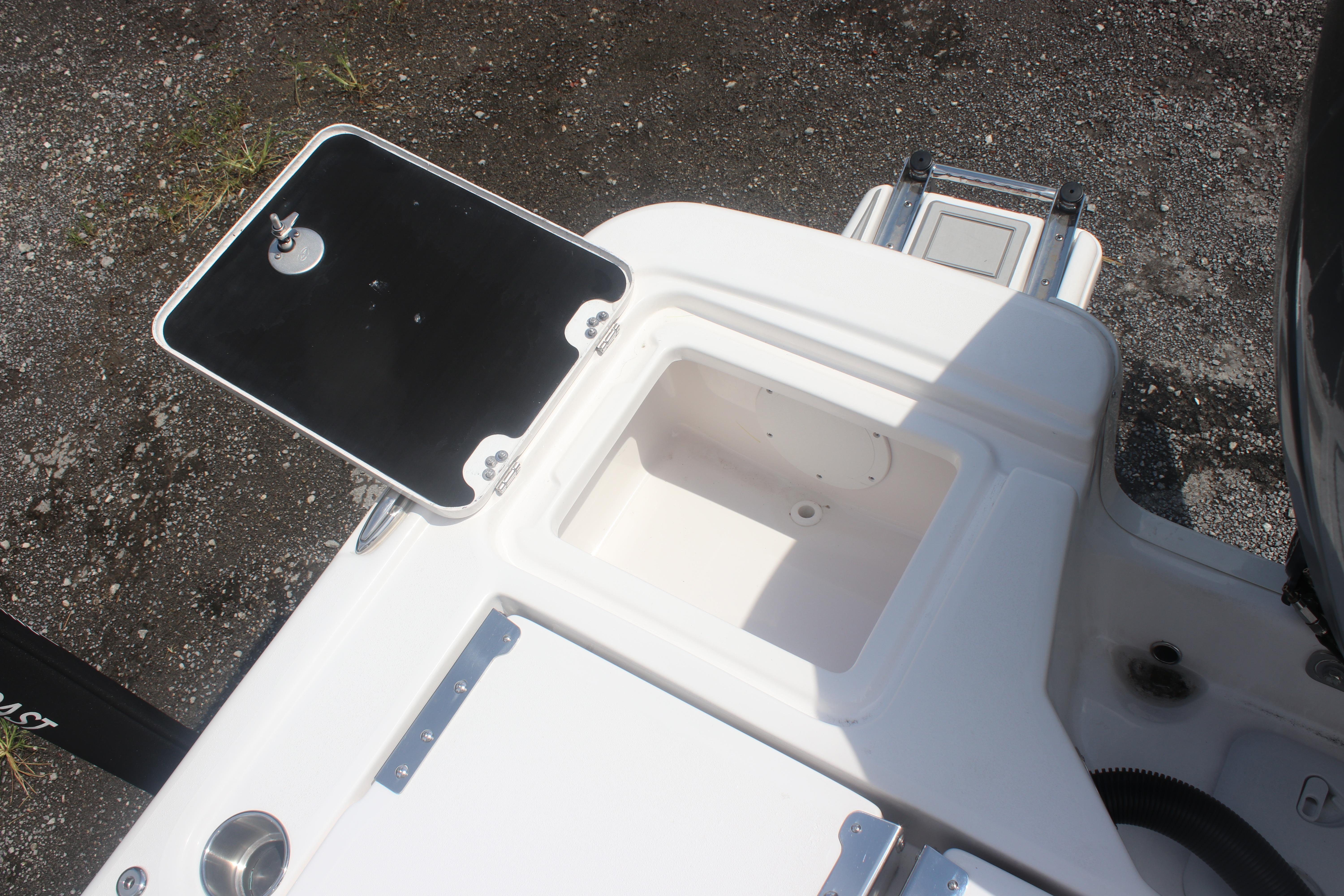 2025 Sea Fox 231 Bay Fox boat storage compartment with open lid.