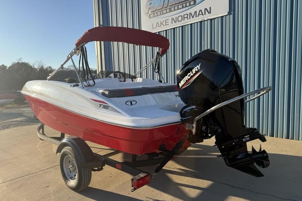 2026 Tahoe T16 boat with Mercury engine, red and white design, parked at Lake Norman.