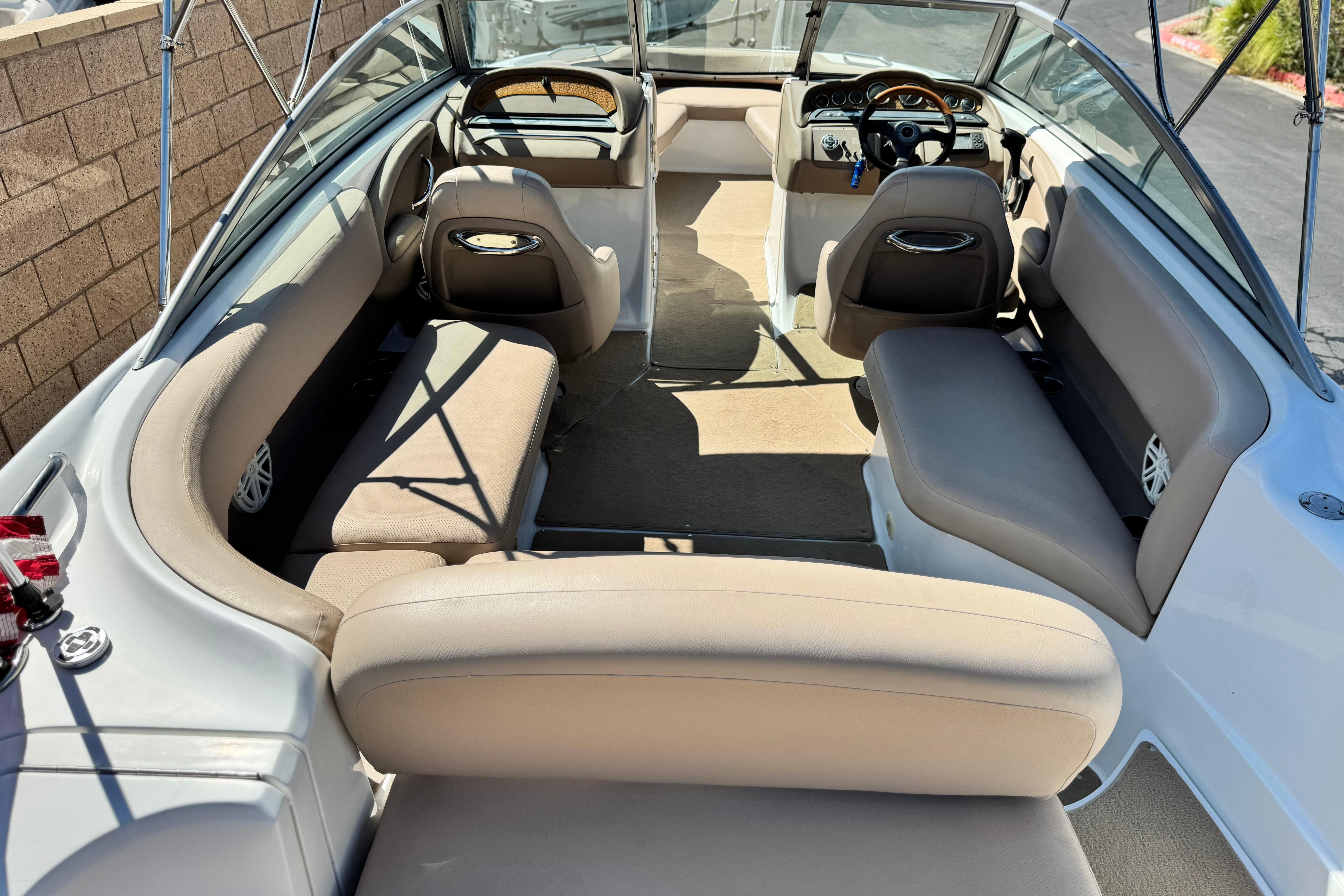 Interior of a 2008 Cobalt 262 boat with beige seating and steering wheel.