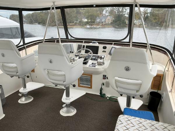 Cockpit of 2000 Novatec Islander 55 yacht with three white captain chairs.