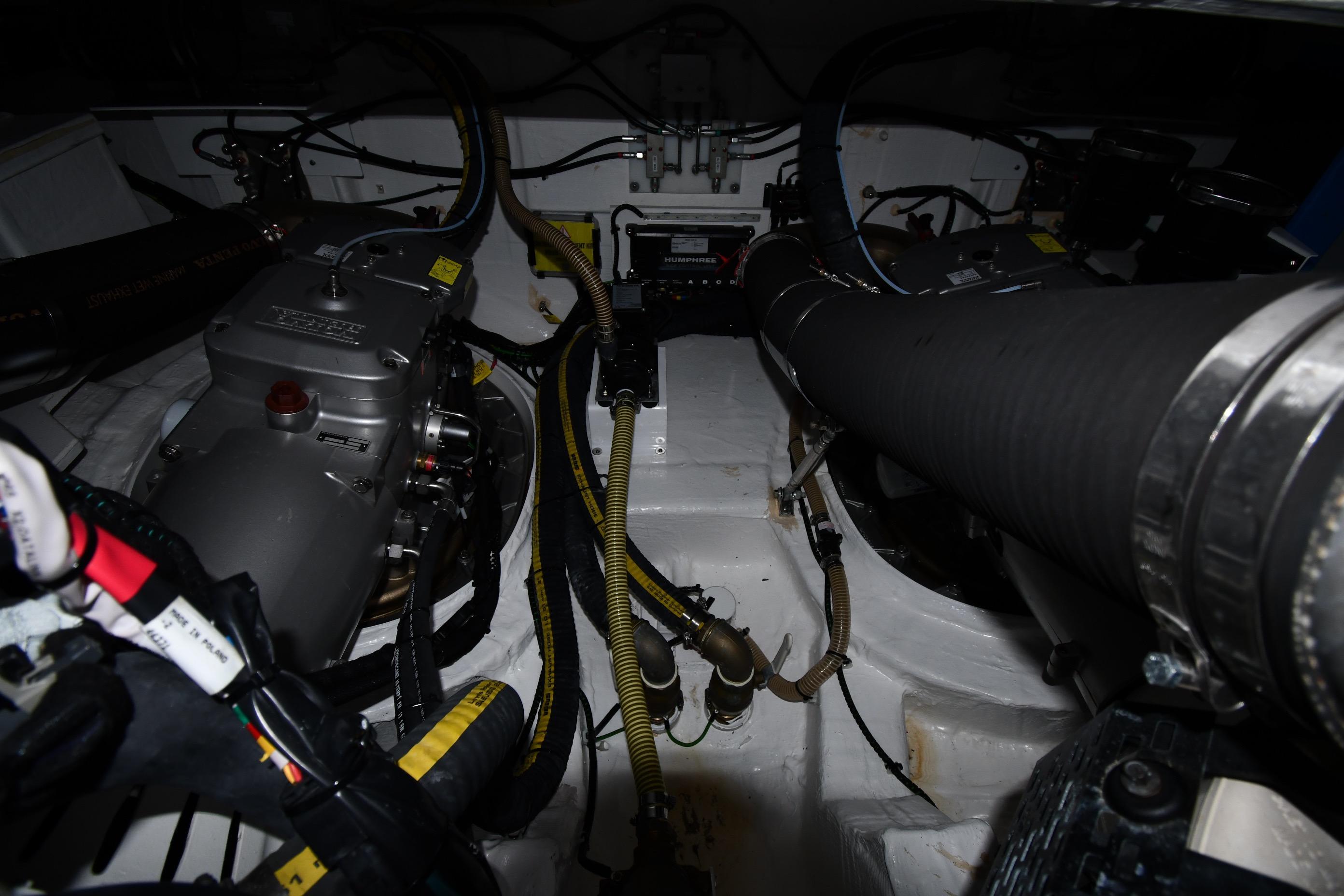 Engine room of 2024 Fairline G50 Targa yacht, showcasing mechanical components and wiring.